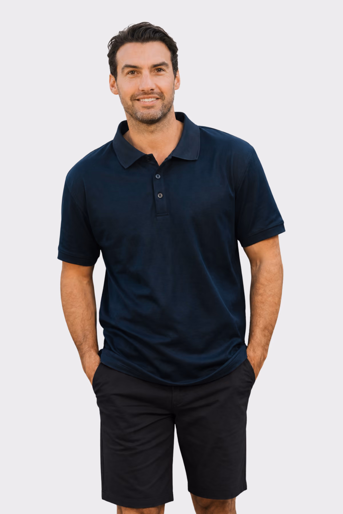 Man wearing a navy aged care polo shirt with black shorts