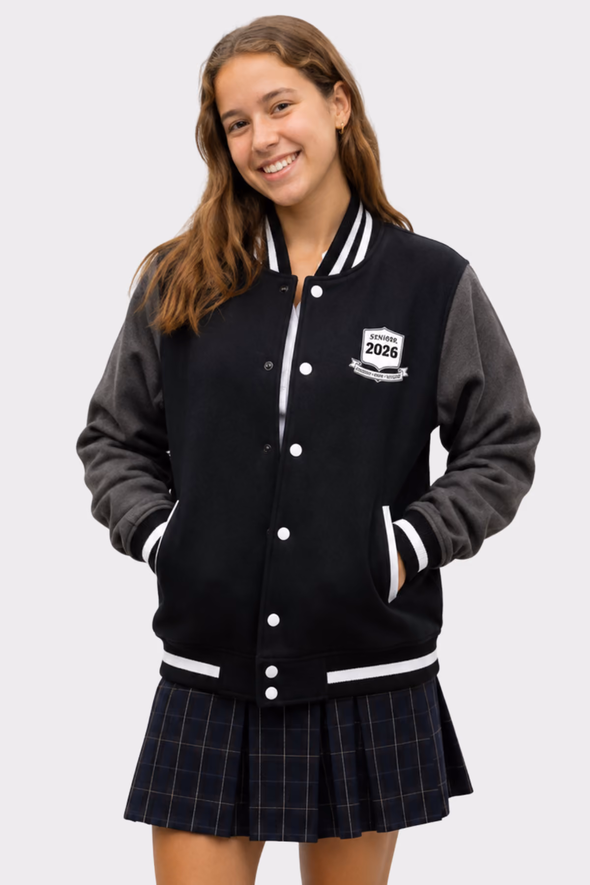 Student wearing a black varsity jacket with grey sleeves and a 2026 crest