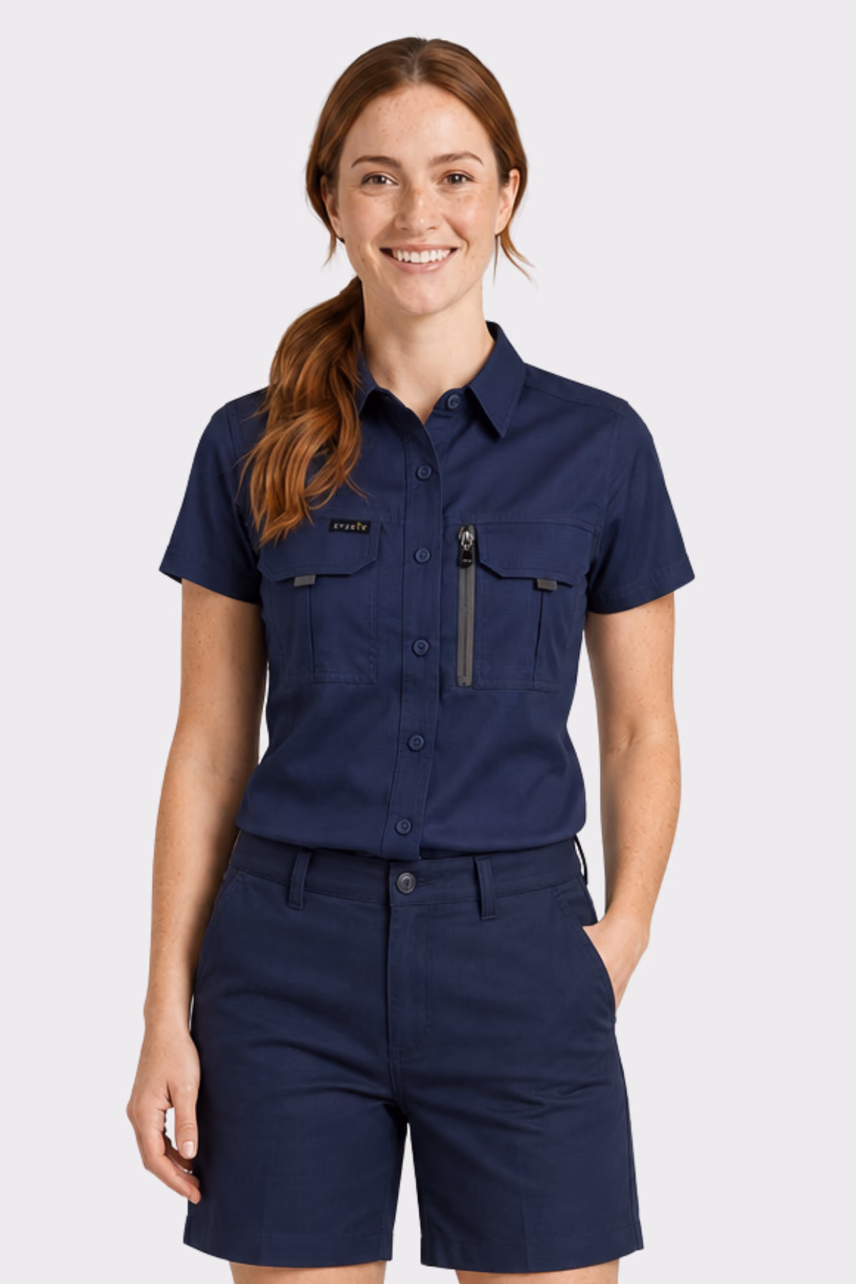 Woman wearing a navy short-sleeve work shirt with navy work shorts