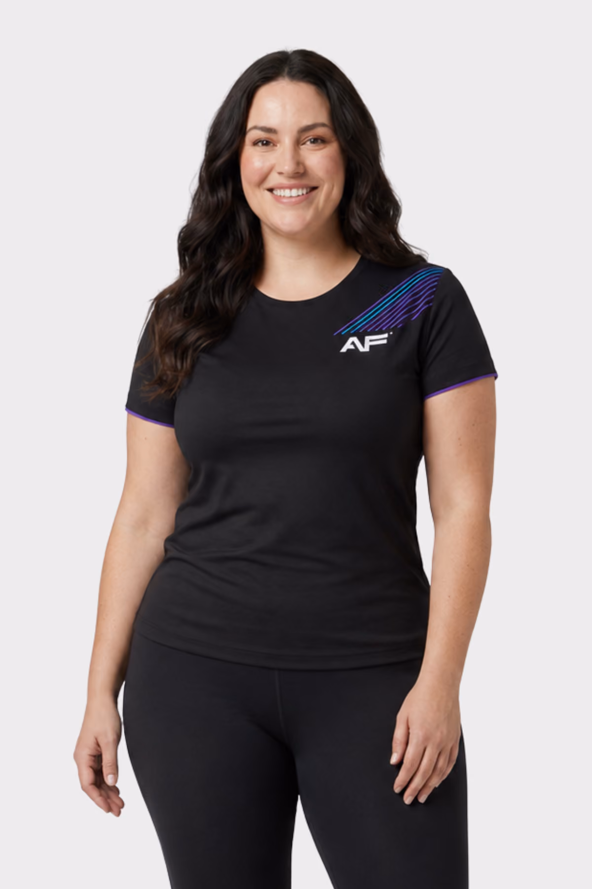 Woman wearing a black branded fitness t-shirt with black leggings