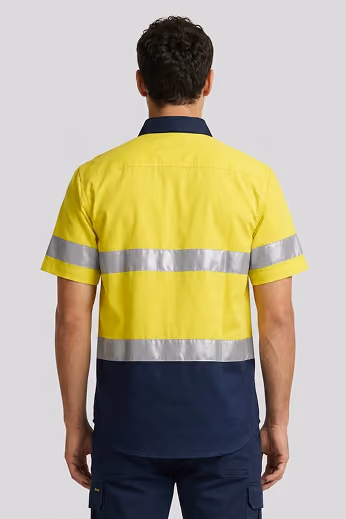 Back view of a man in a yellow and navy hi-vis work shirt