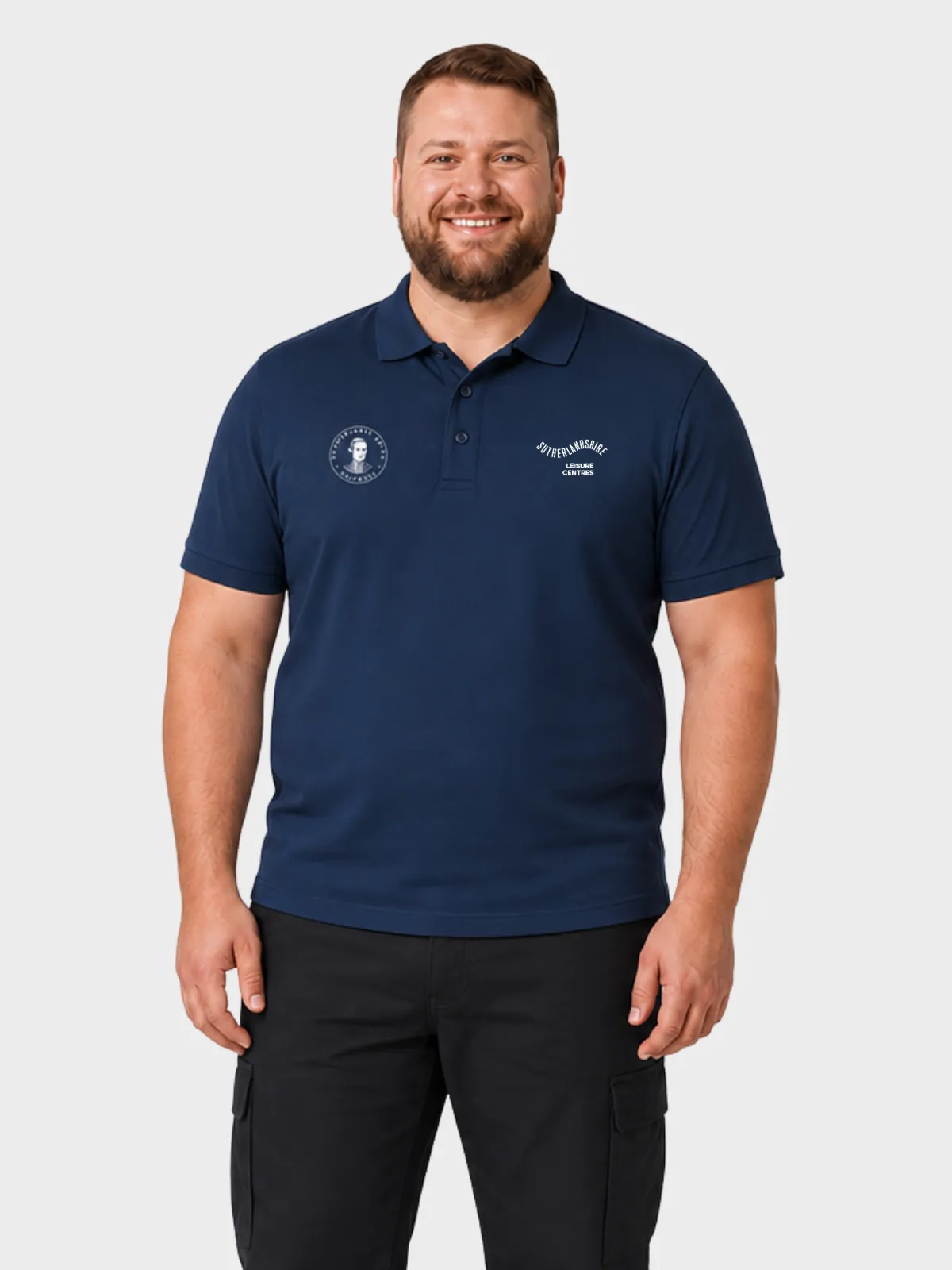 Man wearing a navy branded government polo shirt with black cargo trousers