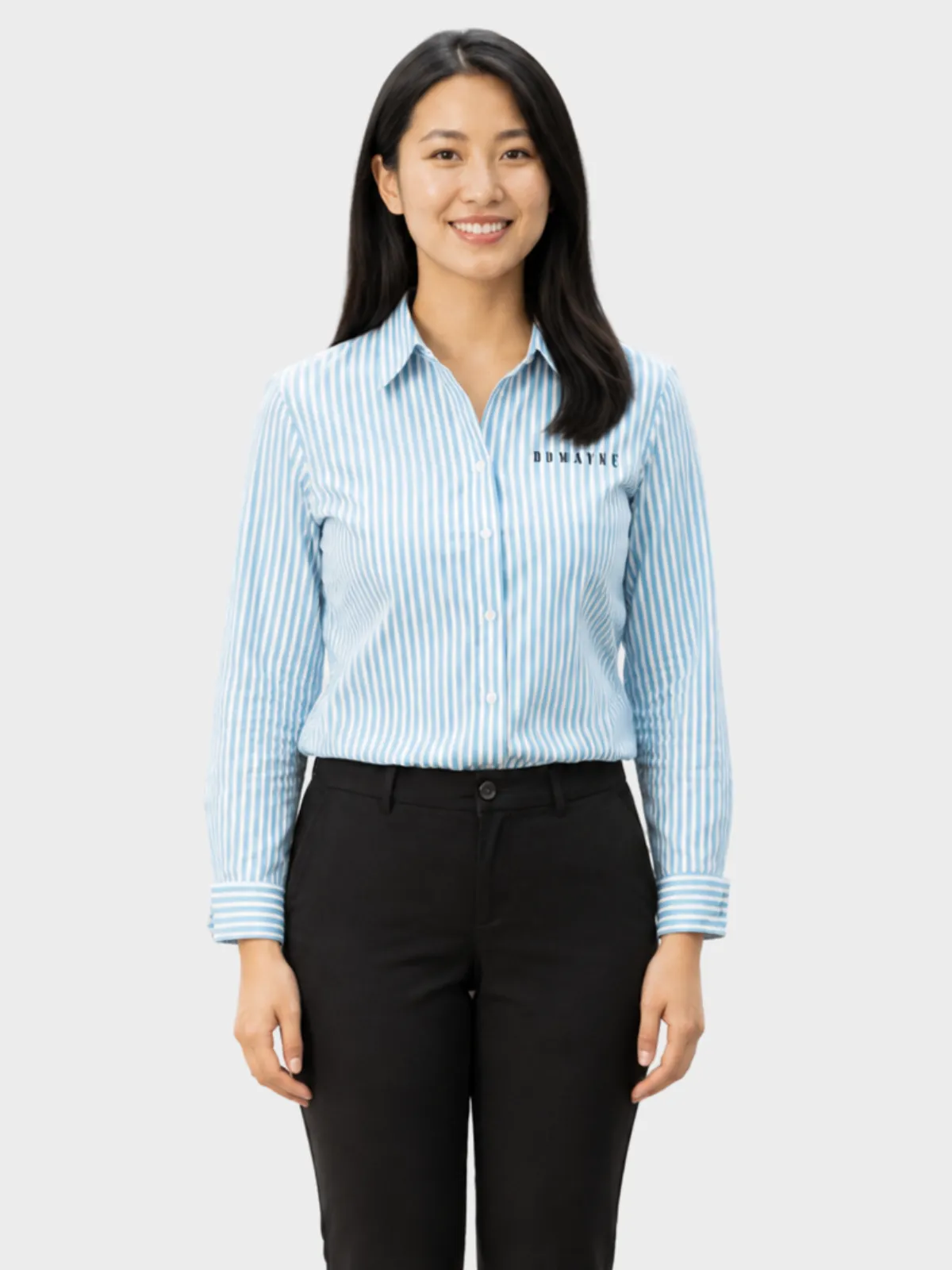 Woman wearing a light blue striped branded retail shirt with black trousers