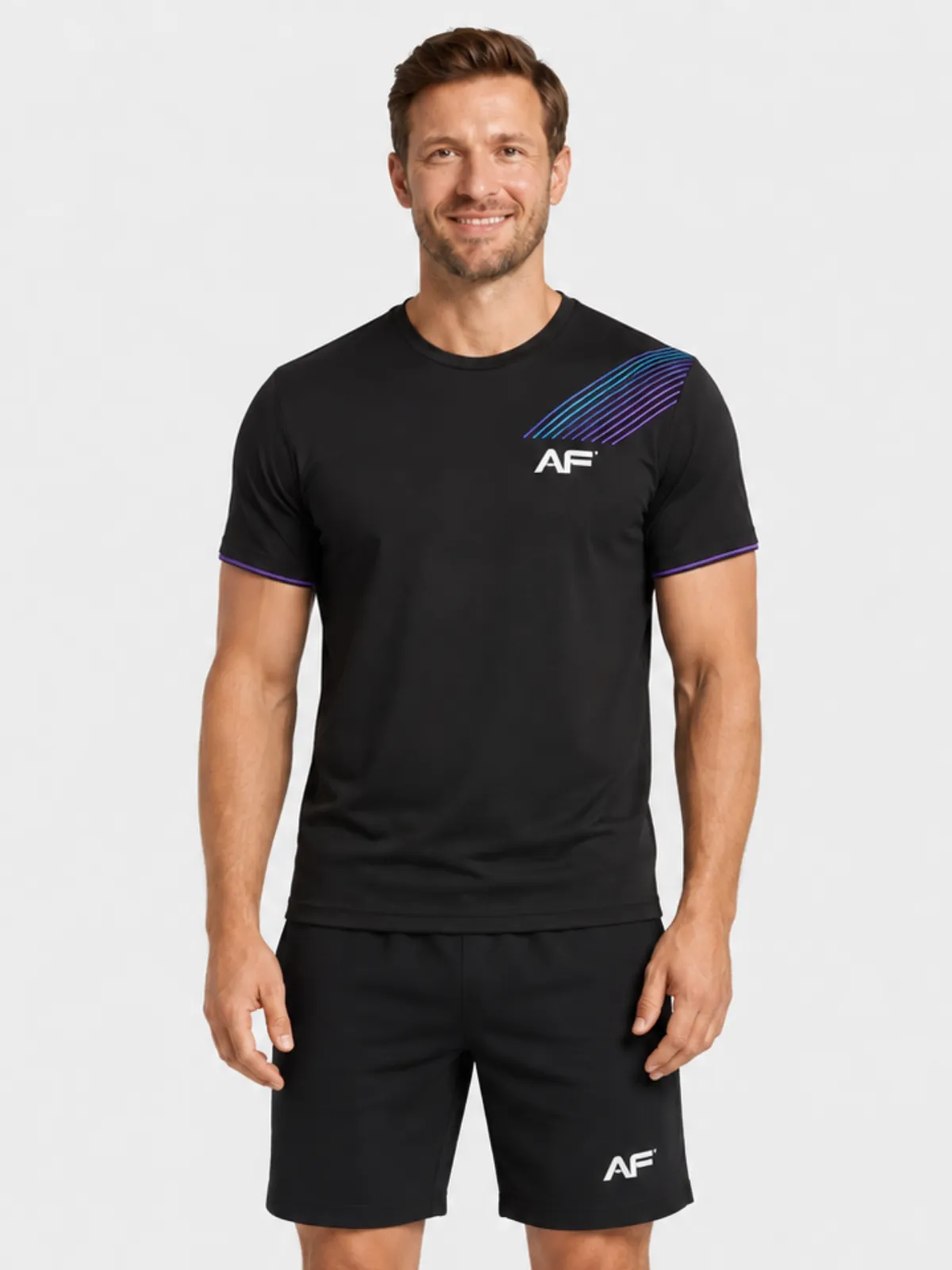 Man wearing a black AF-branded training t-shirt with purple stripes and black shorts