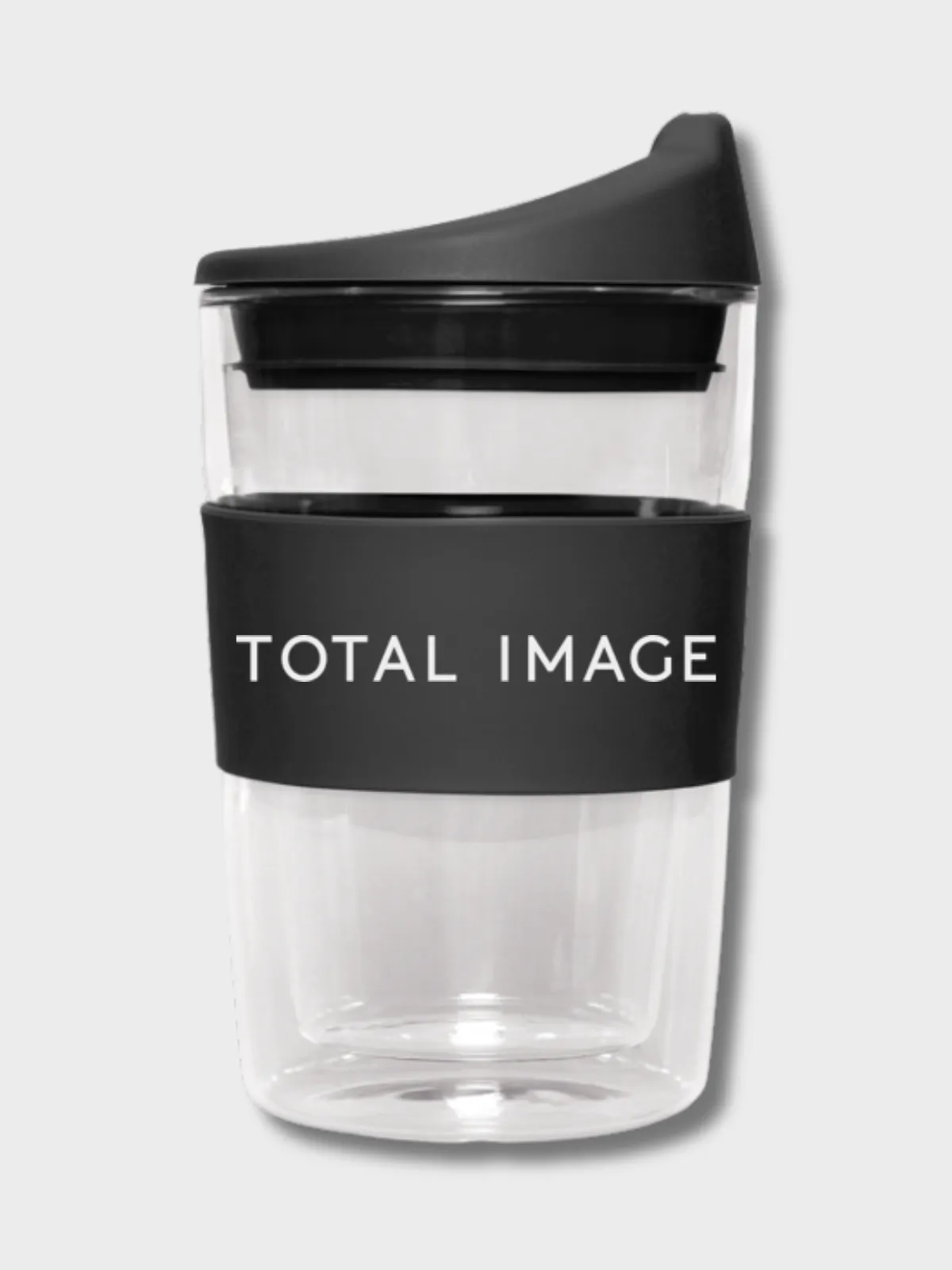 Glass reusable coffee cup with a black Total Image branded band and lid
