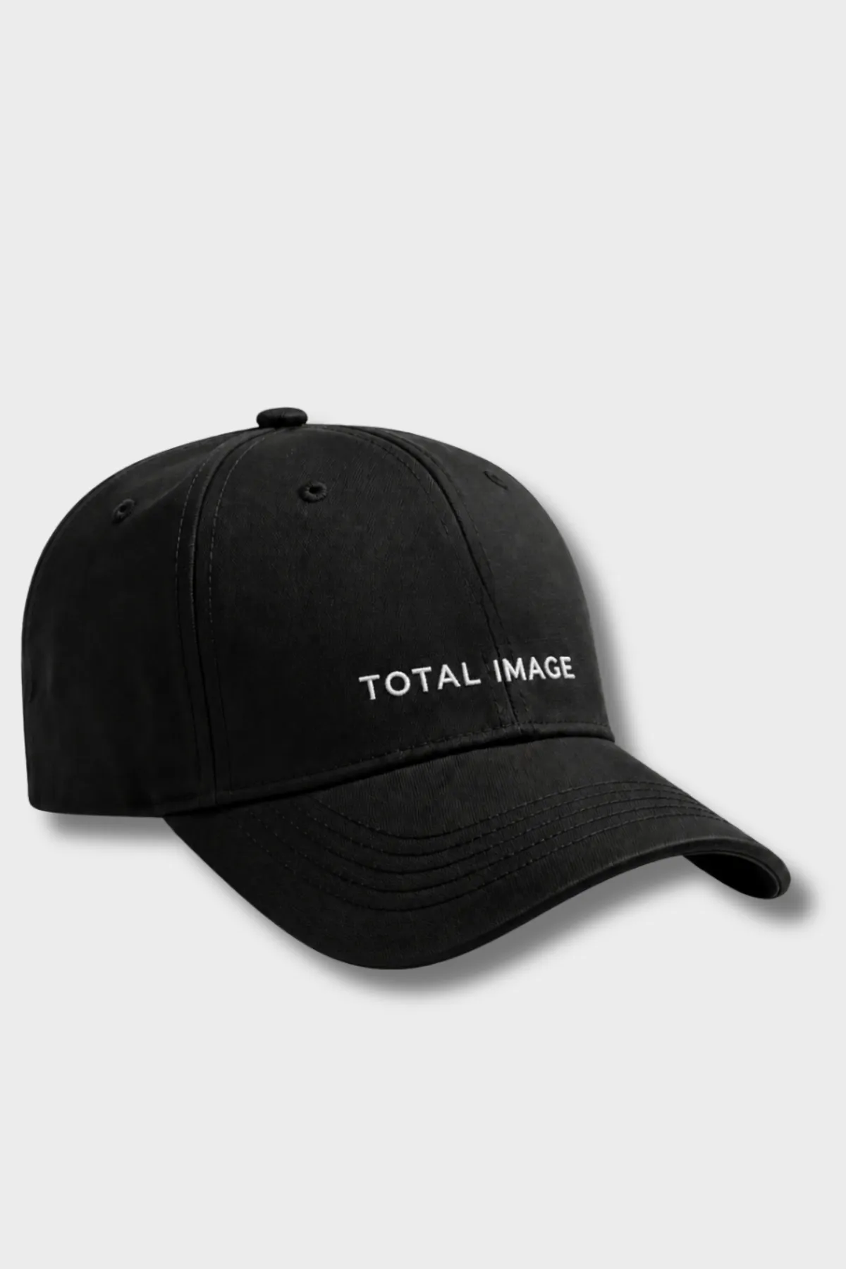 Black cap embroidered with the Total Image logo
