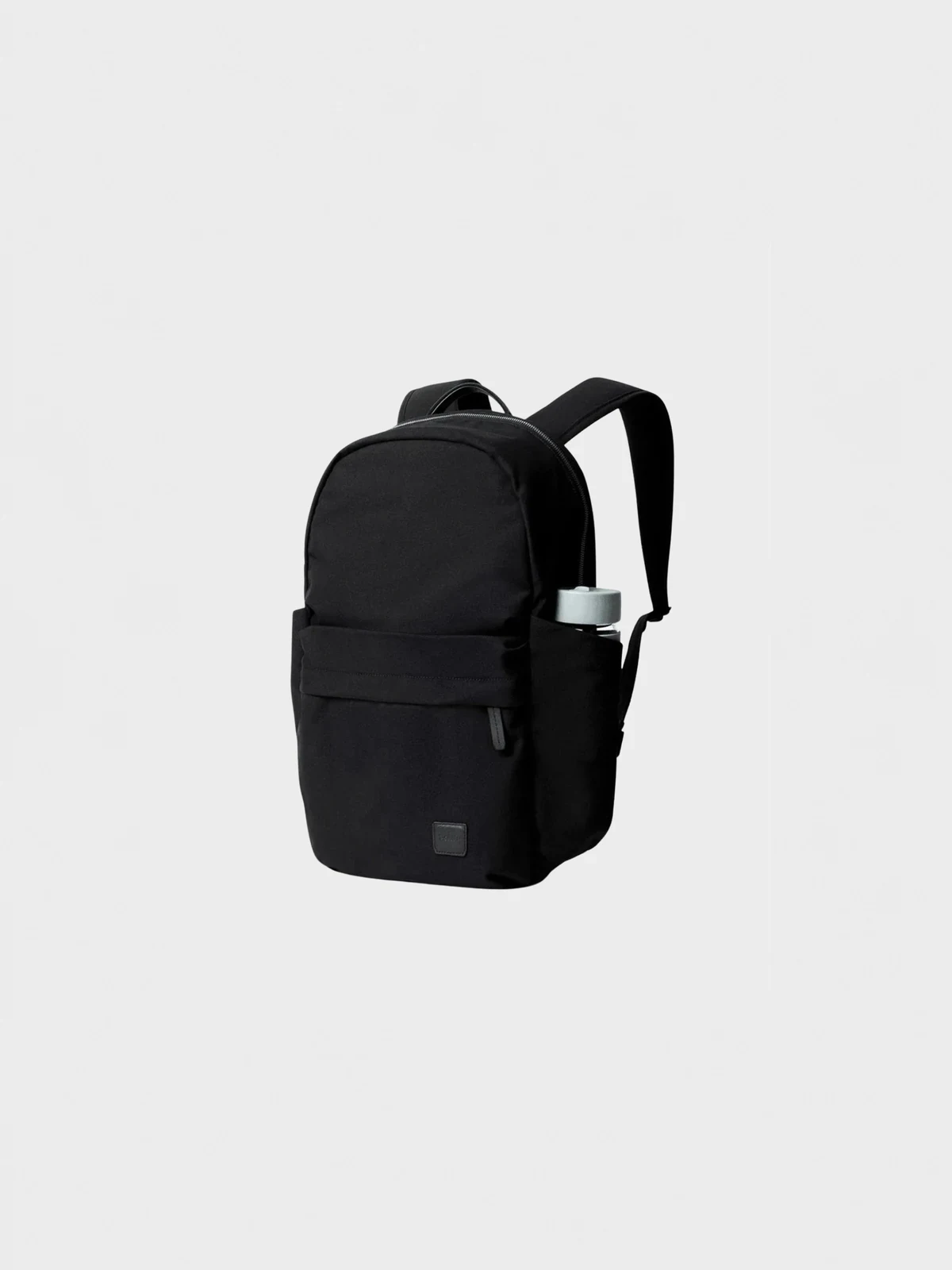 Black backpack with a water bottle in the side pocket