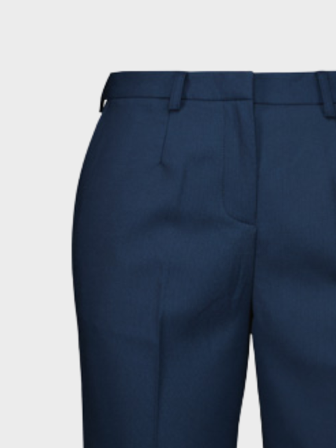 Close-up of navy tailored women's trousers with a pressed crease