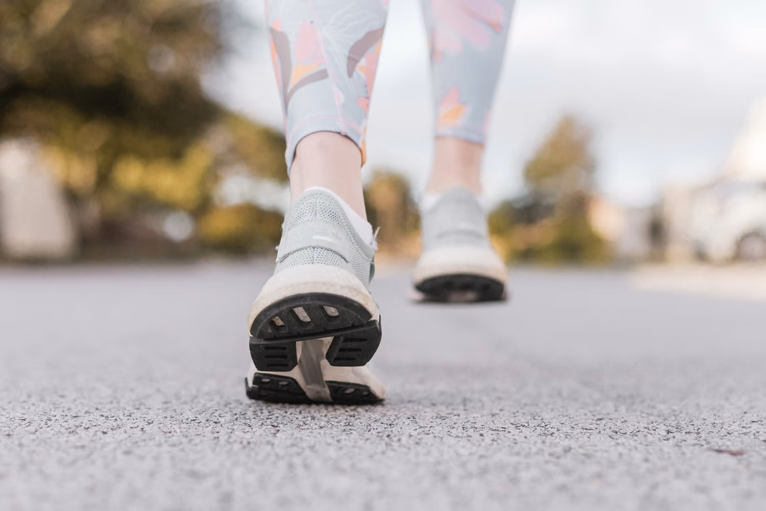 Feet and legs from behind, running, in jogging attire.