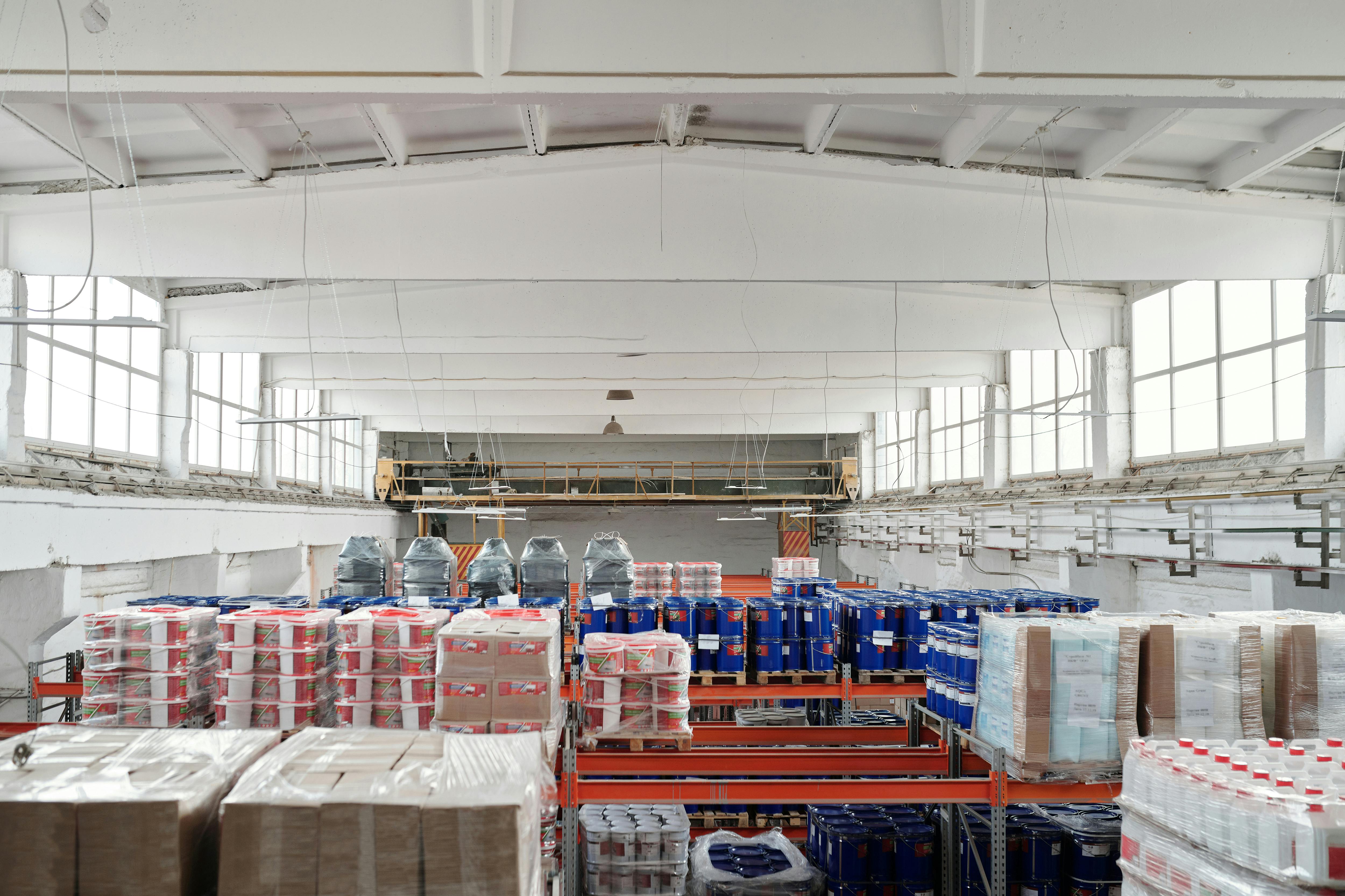 Prepared pallet shipments with shrink wrap, packing slips, and freight documents.
