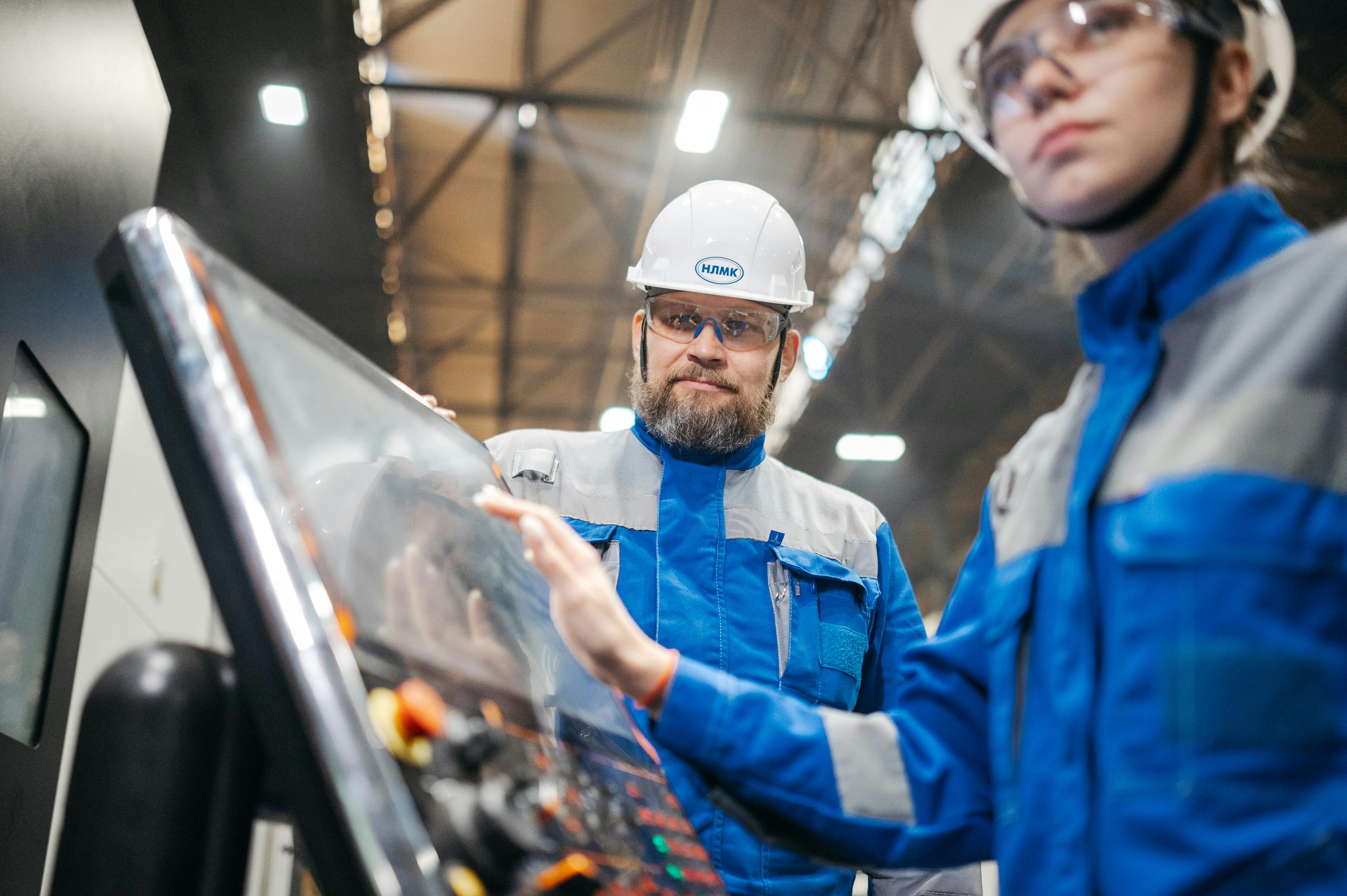 Manager reviewing warehouse processes alongside a warehouse operator.