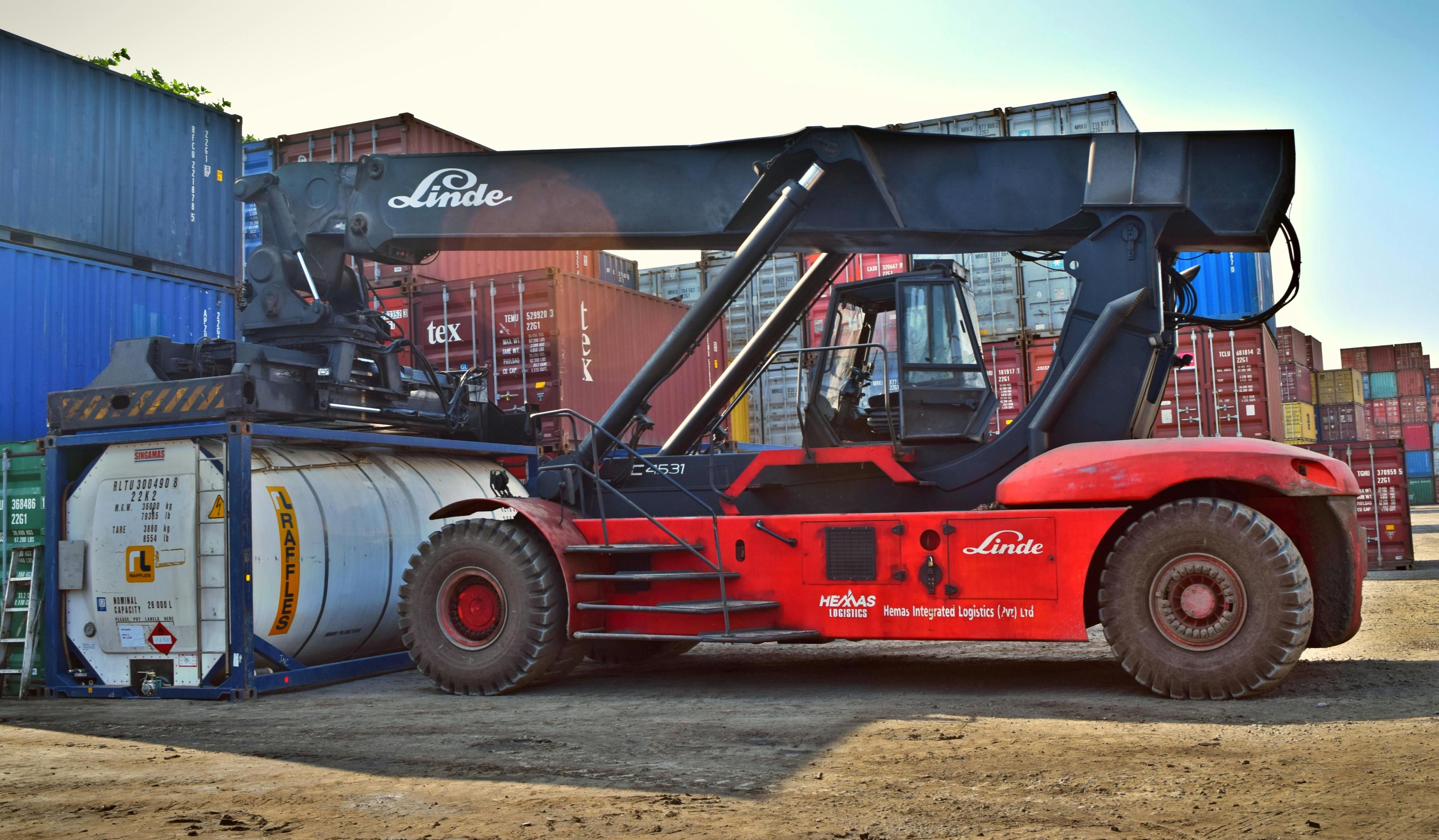 Warehouse operations coordinating diverse products with heavy material-handling machinery.