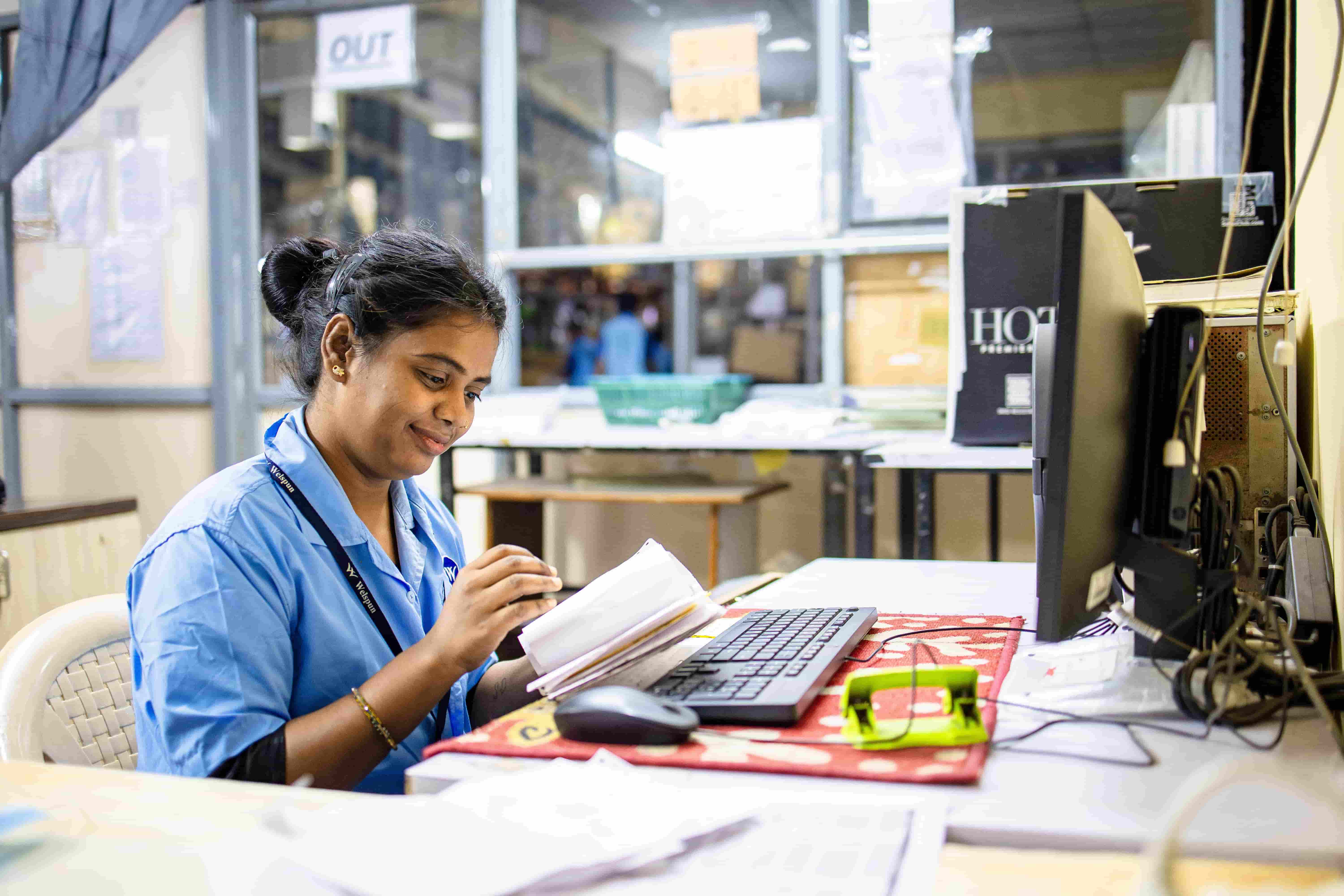 Manufacturing team member operating production machinery
