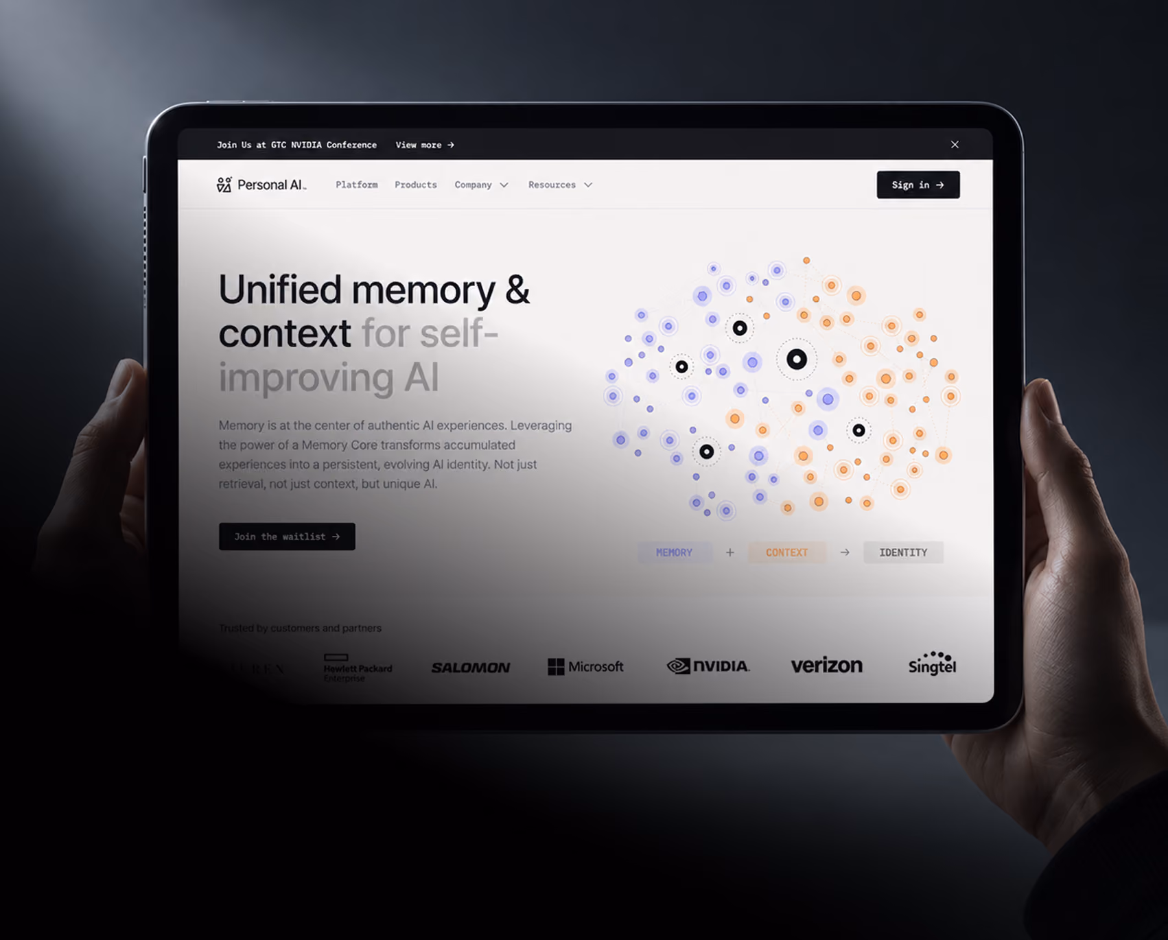 Hands holding a tablet showing the Personal AI website hero: "Unified memory & context for self-improving AI" with a memory network graphic