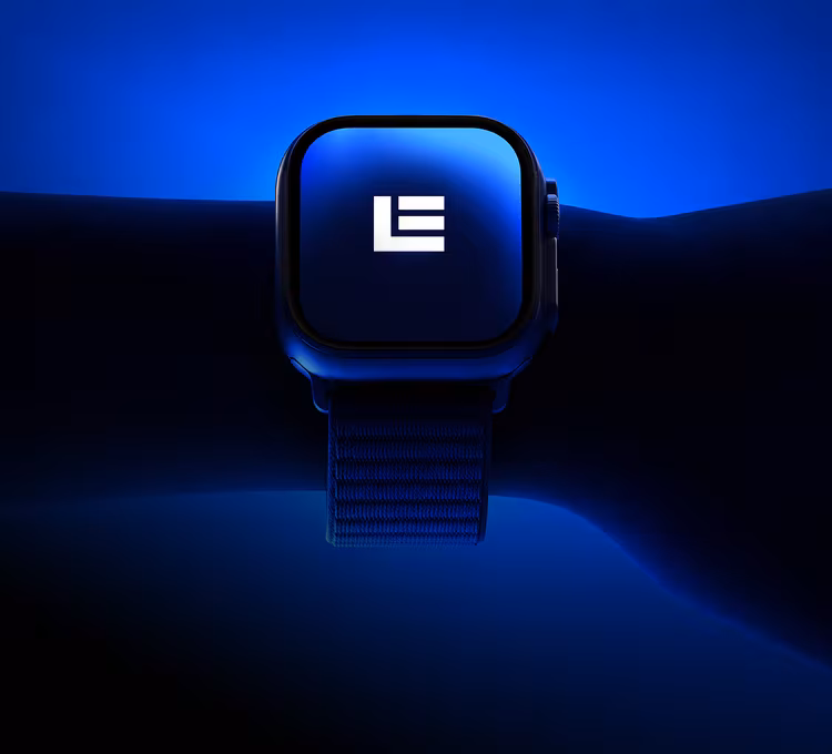 Smartwatch on a wrist displaying the white Lebane logo on its screen, glowing against a deep blue background