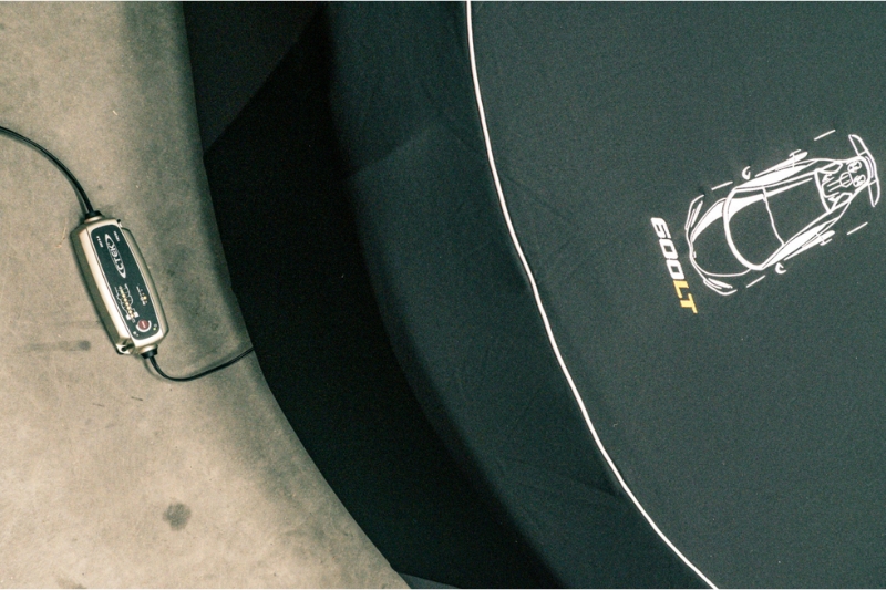 Battery conditioner connected to a supercar in dehumidified storage at Auto Classica, Milton Keynes.