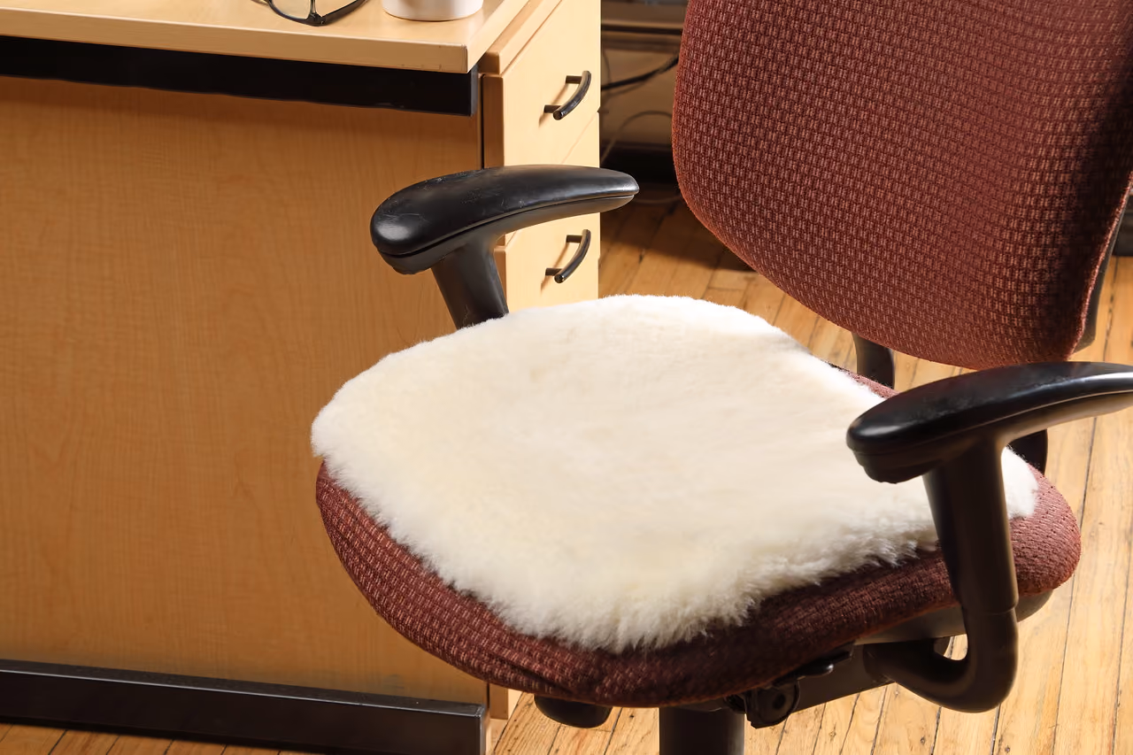 Bumwarmer sheepskin seat cushion on an office chair