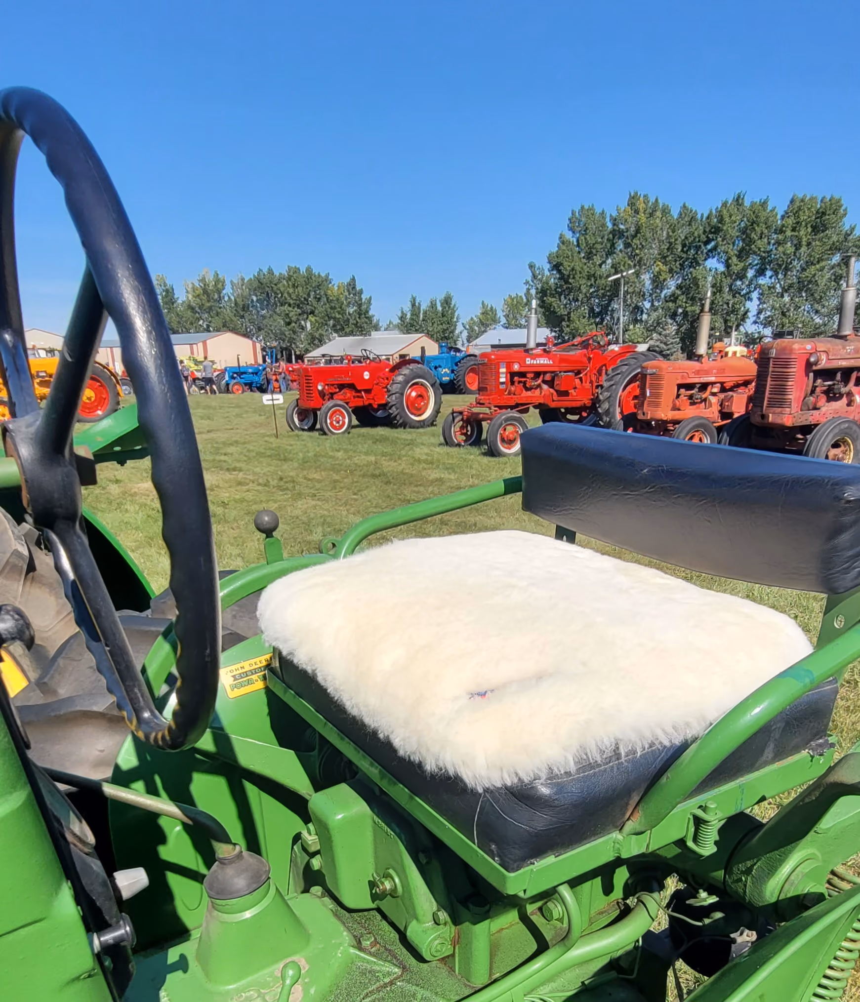 Bumwarmer sheepskin seat cushion on a vintage tractor seat