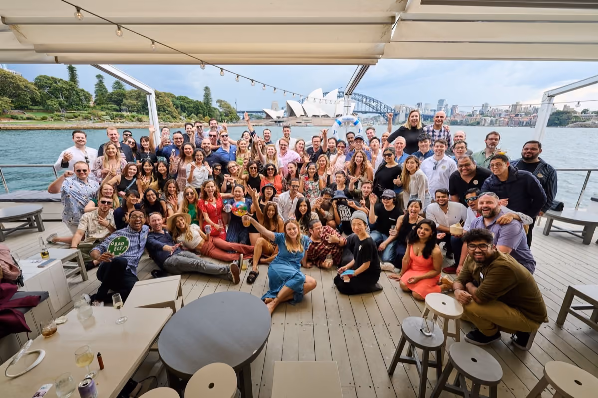 The JobAdder team at the Sydney office, with the Opera House behind