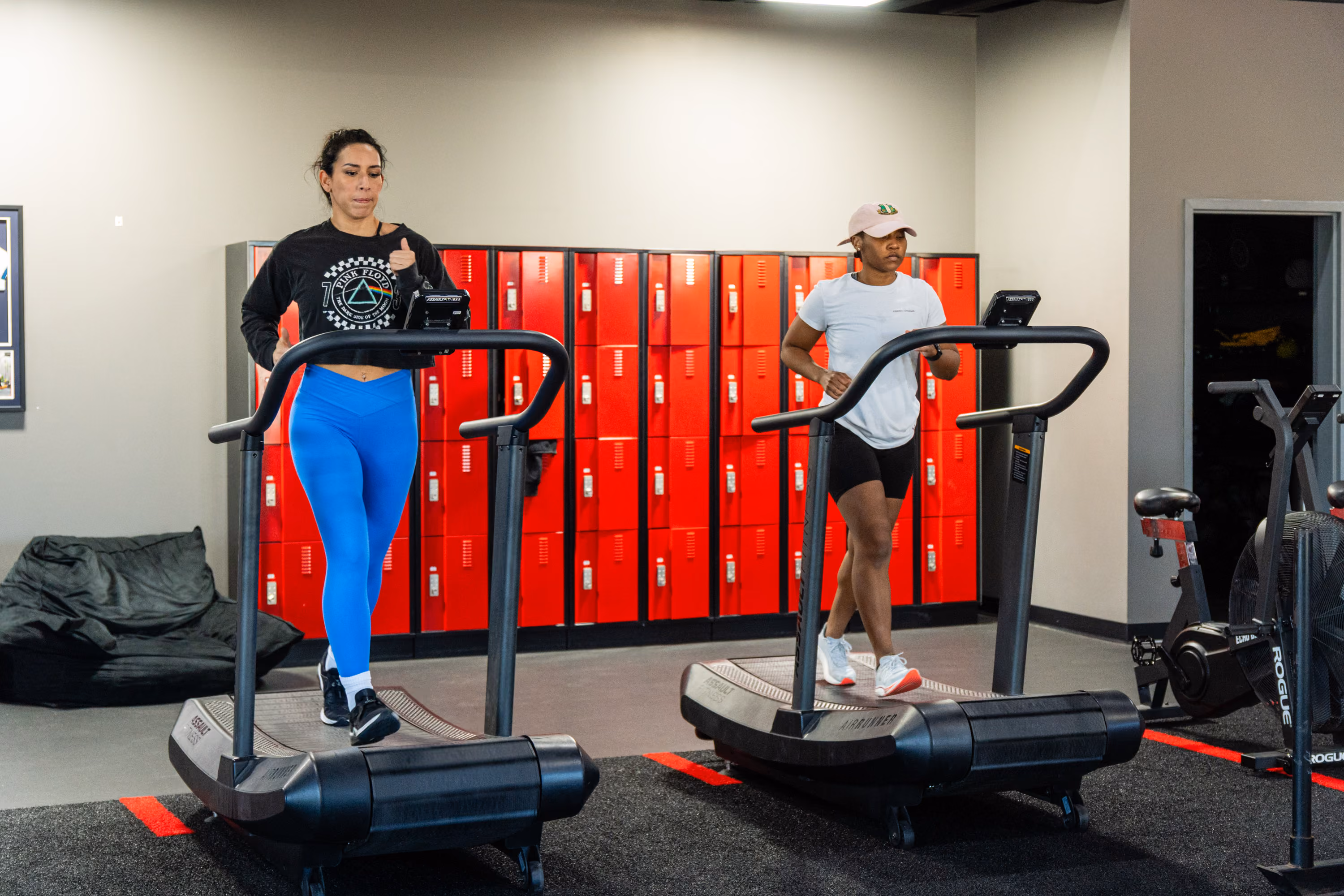 Woman on a treadmill in the locker room area at Kinitro Fitness