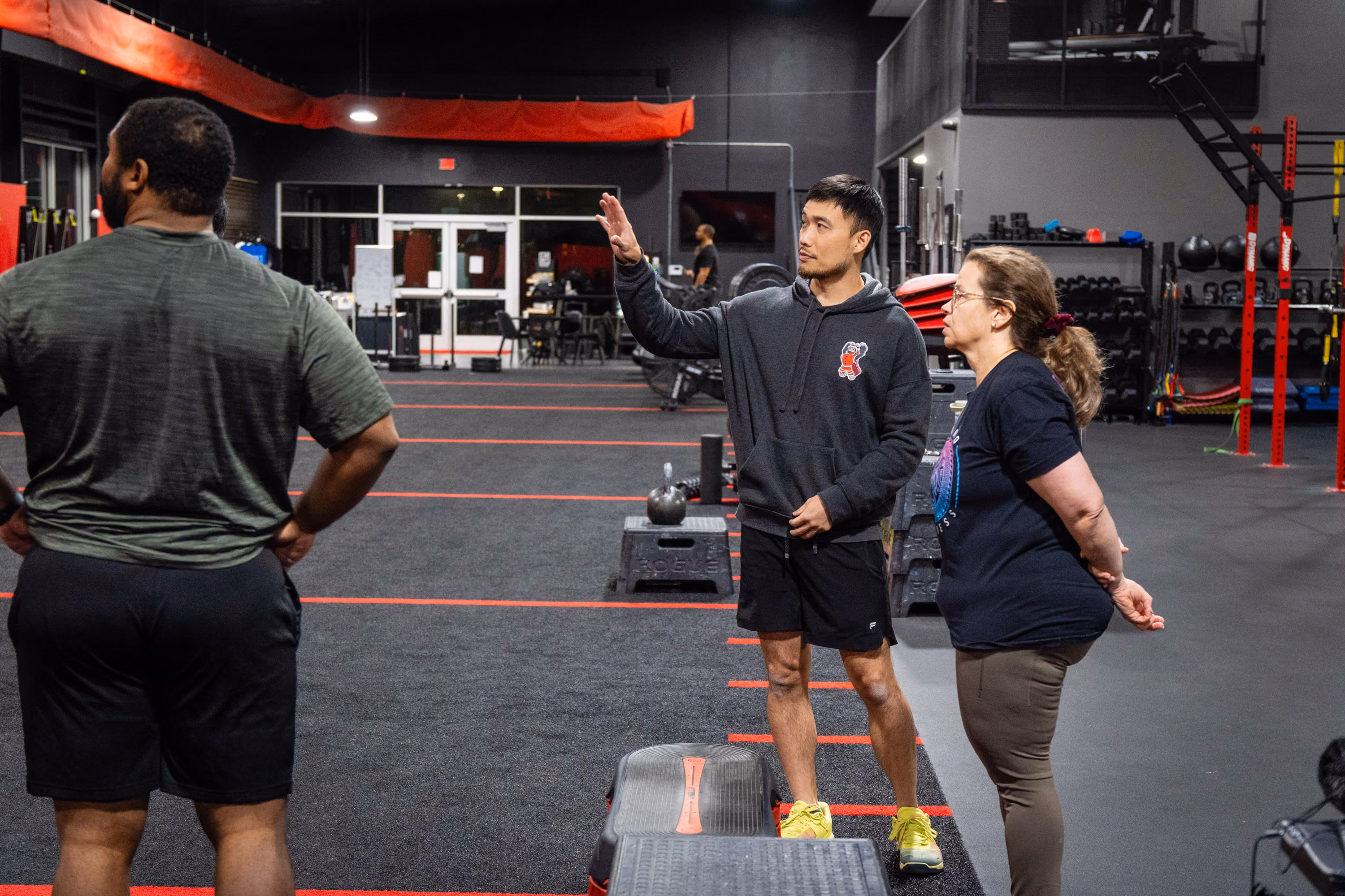 Coach talking with clients at Kinitro Fitness