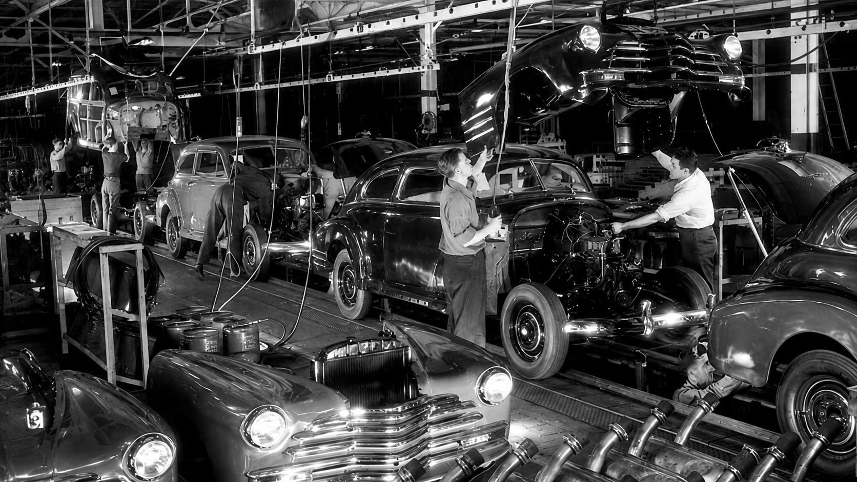 Workers on a mid-century General Motors assembly line in Michigan