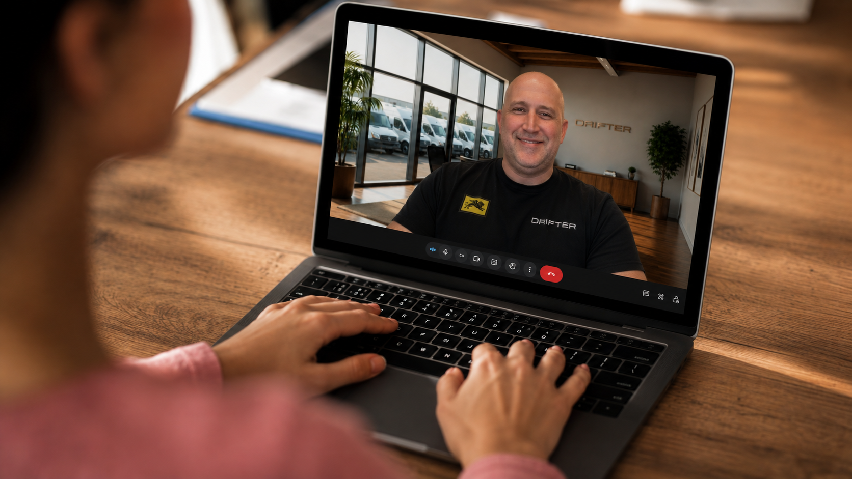 Future owner on a video discovery call with Paul Domish in the Drifter showroom