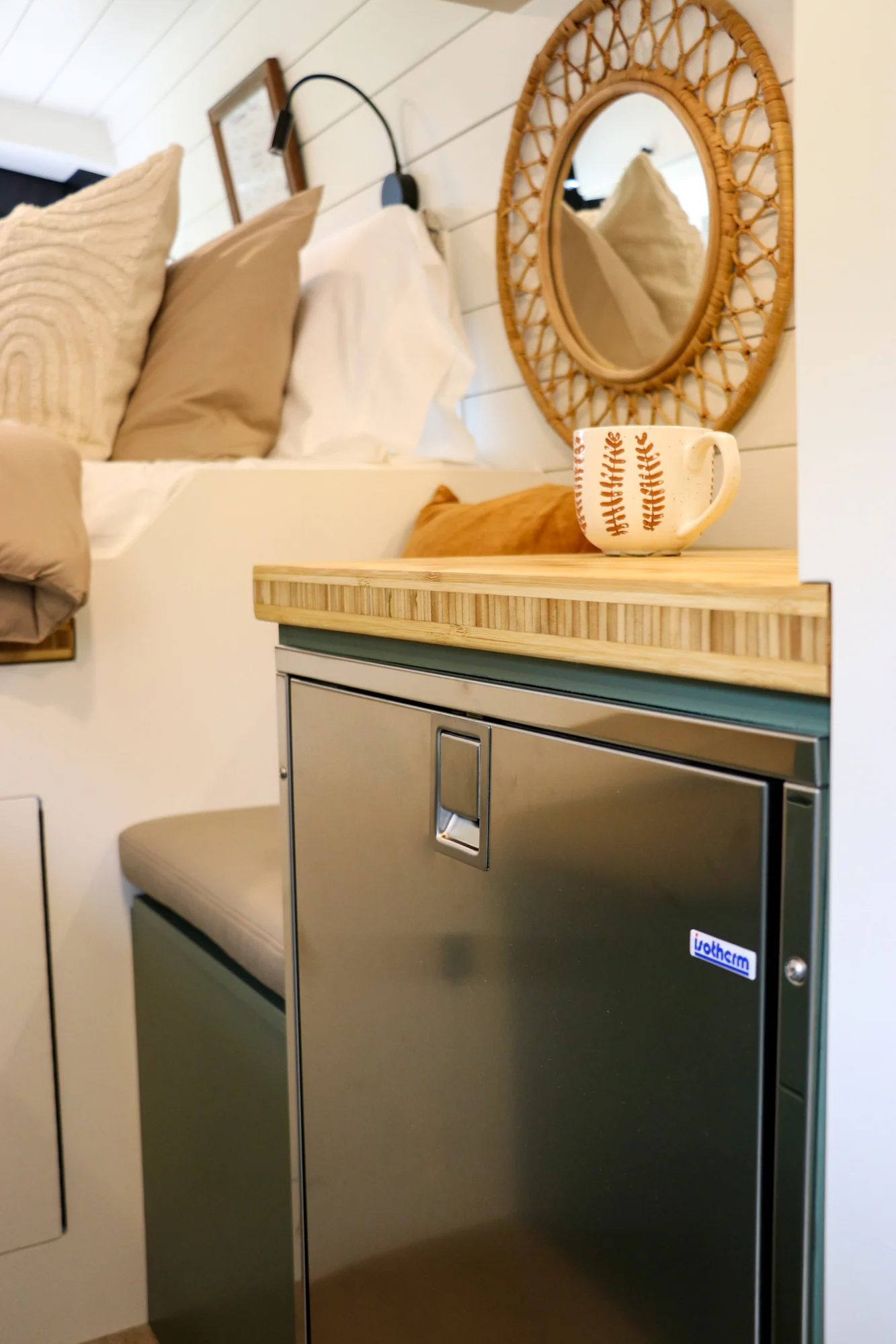 The Drifter 101 custom Ford Transit campervan built for Mallory and Matt by Drifter Vans, Nomadik layout with a bamboo countertop, matte black fixtures, marble shower, and Abyss Grey exterior