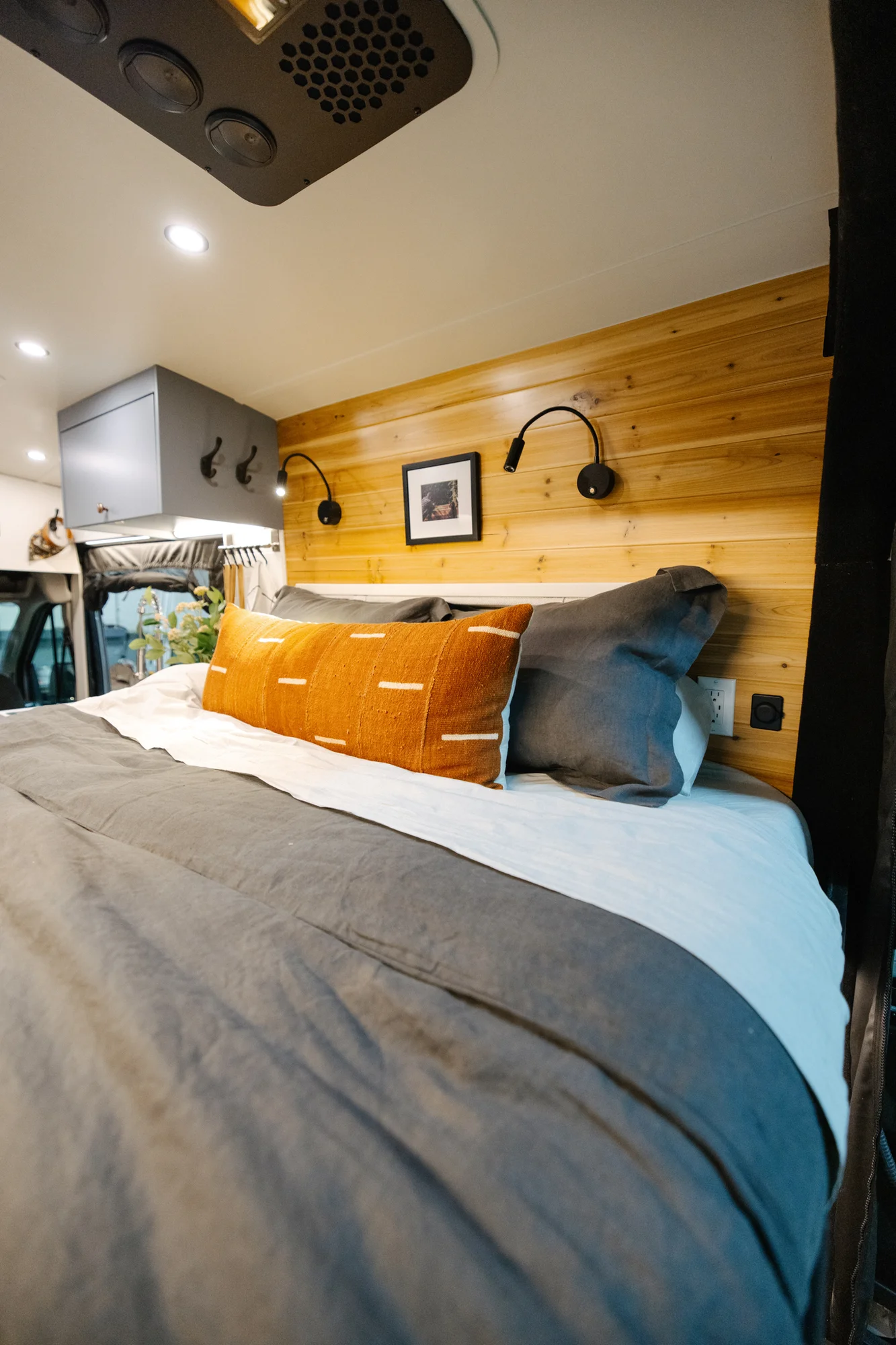 The Drifter 101 custom Ford Transit campervan built for Derek by Drifter Vans, Wanderer layout with a rear Overland Kitchen, knotty pine walls, and grey cabinetry