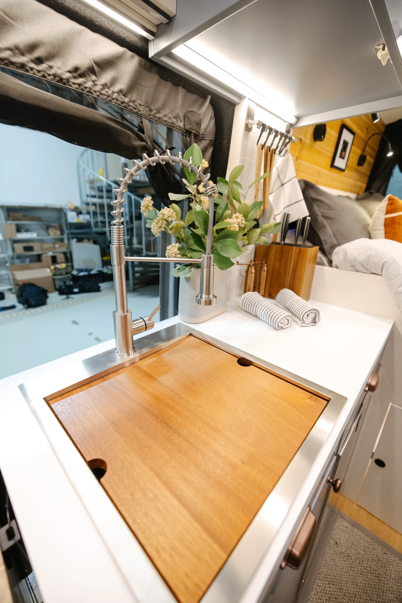 The Drifter 101 custom Ford Transit campervan built for Derek by Drifter Vans, Wanderer layout with a rear Overland Kitchen, knotty pine walls, and grey cabinetry