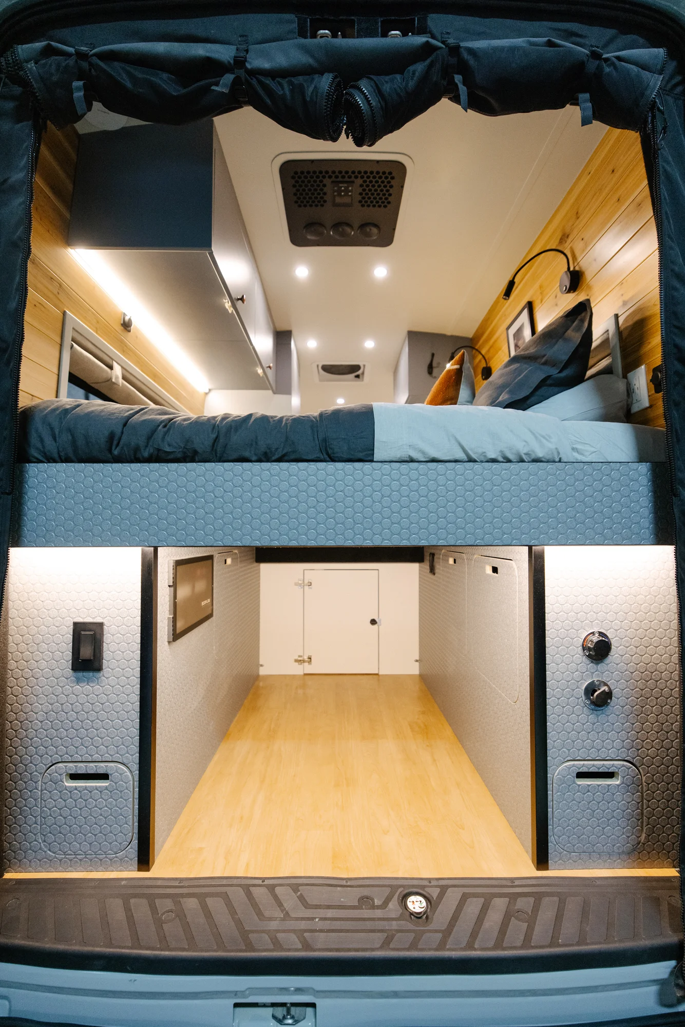The Drifter 101 custom Ford Transit campervan built for Derek by Drifter Vans, Wanderer layout with a rear Overland Kitchen, knotty pine walls, and grey cabinetry