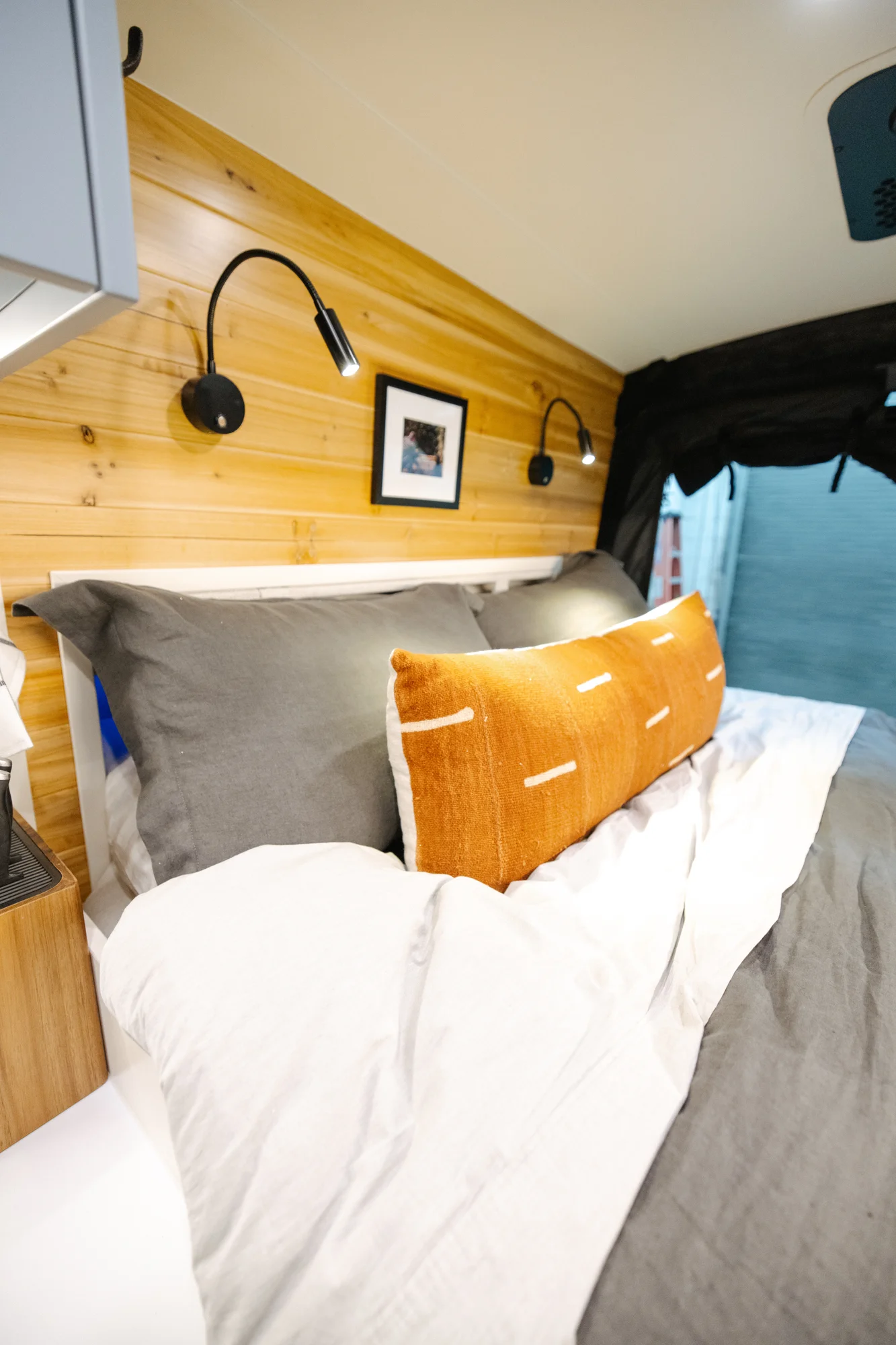The Drifter 101 custom Ford Transit campervan built for Derek by Drifter Vans, Wanderer layout with a rear Overland Kitchen, knotty pine walls, and grey cabinetry