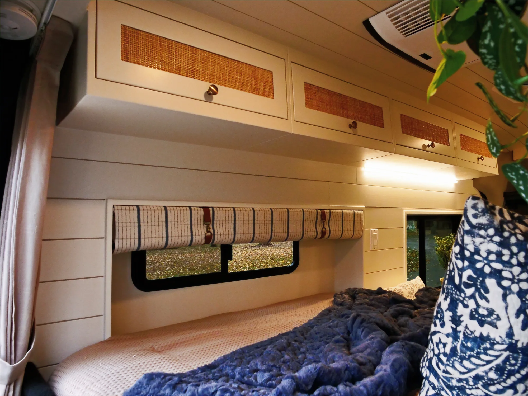 The Drifter 101 custom Ford Transit campervan built for Lori by Drifter Vans, Wanderer layout with a modern farmhouse interior, maple butcher block countertop, gold fixtures, and an exterior FVCO roof rack and ladder