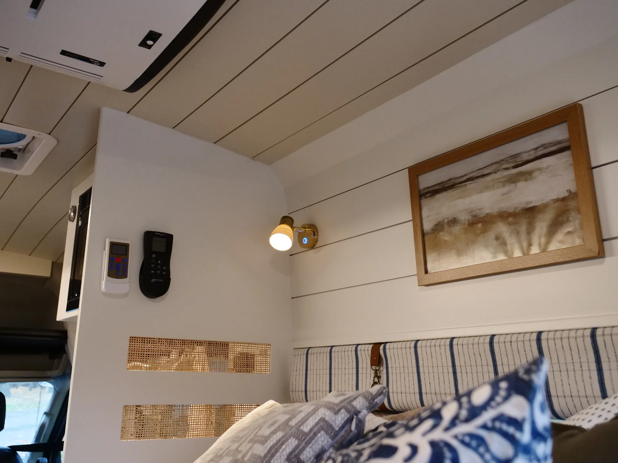 The Drifter 101 custom Ford Transit campervan built for Lori by Drifter Vans, Wanderer layout with a modern farmhouse interior, maple butcher block countertop, gold fixtures, and an exterior FVCO roof rack and ladder