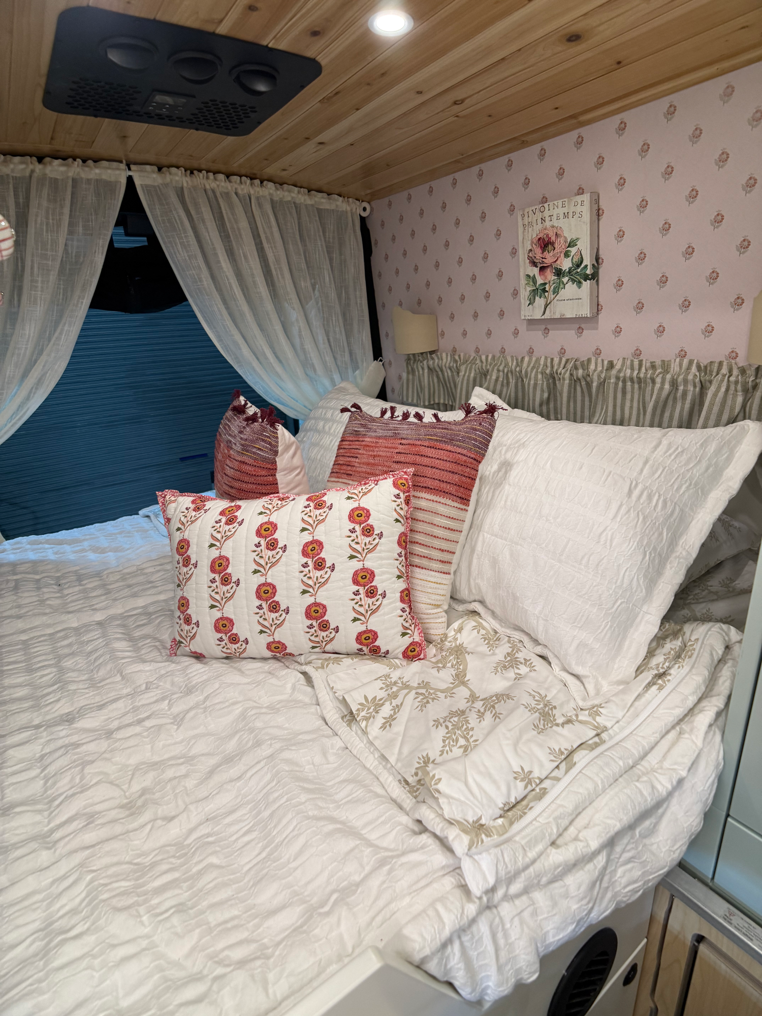 The Drifter 101 custom Ford Transit campervan built for Lori Smith by Drifter Vans, Drifter layout with a cottage garden-inspired interior, handcrafted cabinetry, and custom luxury finishes