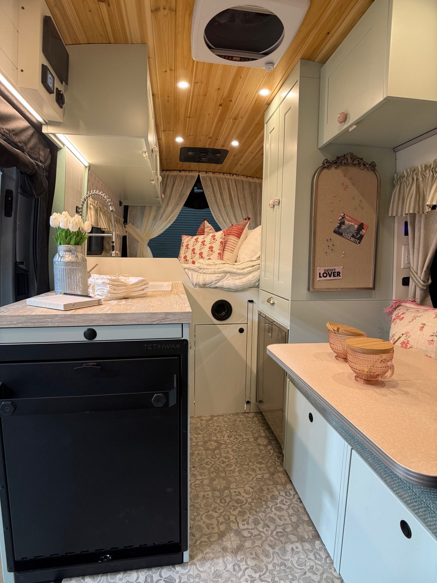 The Drifter 101 custom Ford Transit campervan built for Lori Smith by Drifter Vans, Drifter layout with a cottage garden-inspired interior, handcrafted cabinetry, and custom luxury finishes