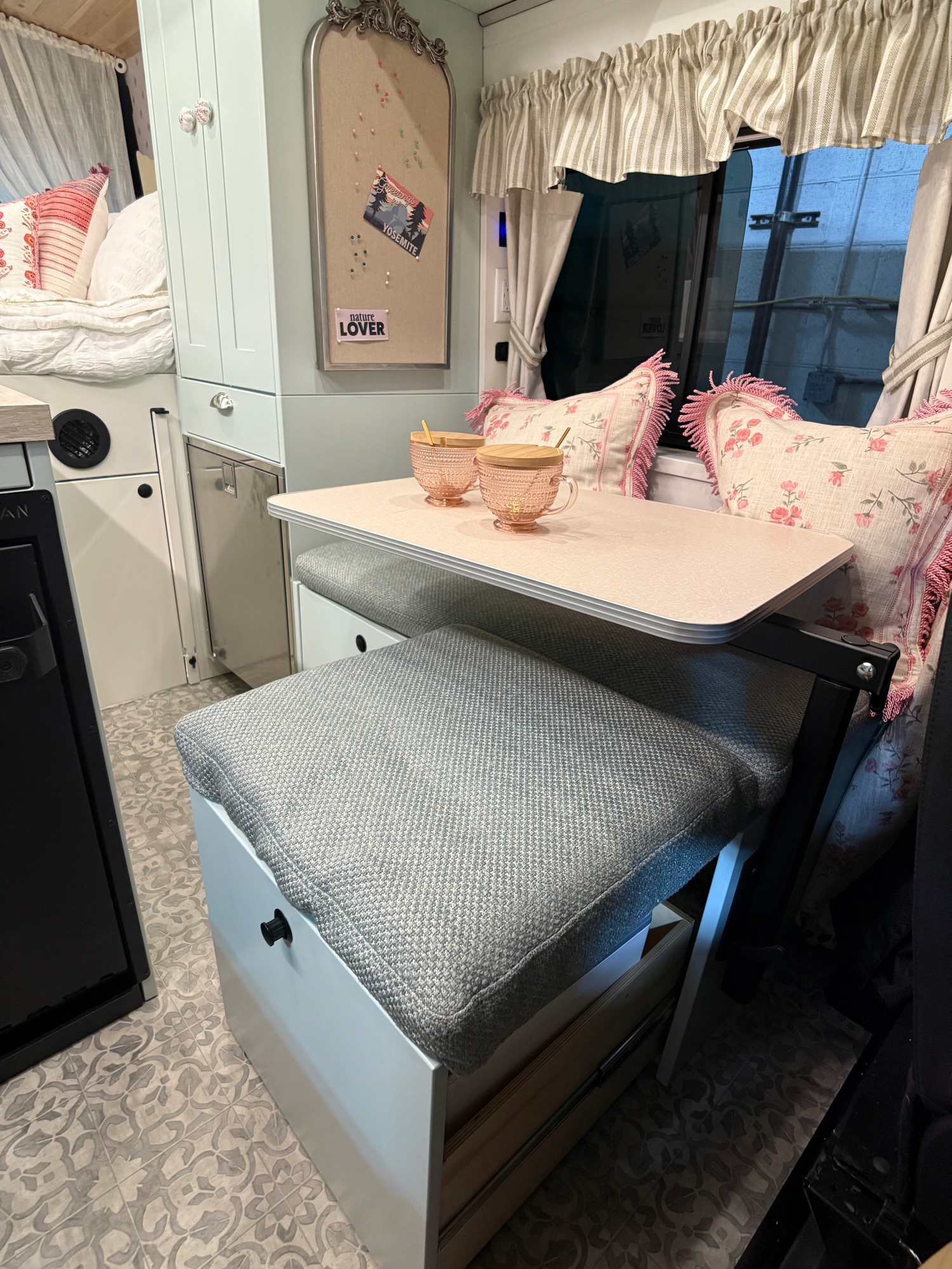 The Drifter 101 custom Ford Transit campervan built for Lori Smith by Drifter Vans, Drifter layout with a cottage garden-inspired interior, handcrafted cabinetry, and custom luxury finishes