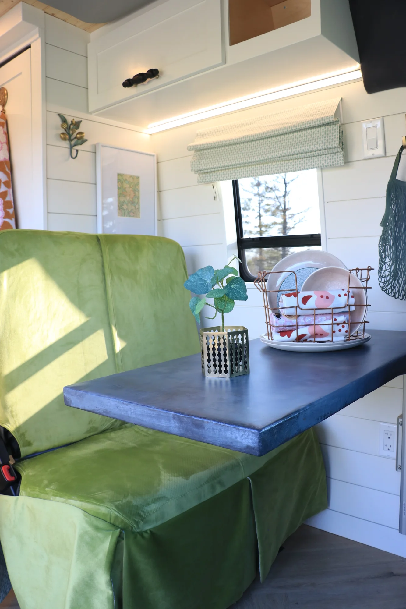 The Drifter 101 custom Mercedes-Benz Sprinter campervan built for Suzzane by Drifter Vans, with geometric patterned tile, sage green seating, white shiplap walls, and brass fixtures