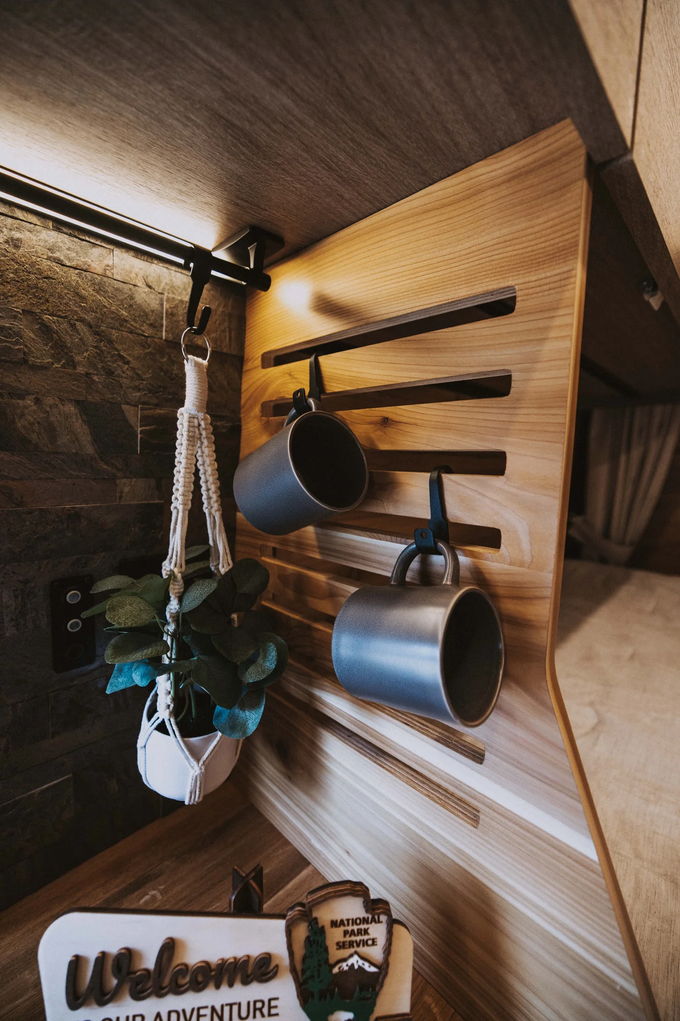 The Drifter 101 custom Ford Transit campervan built for Ken and Terry by Drifter Vans, with cedar plank walls, ambient lighting, and a compact dinette