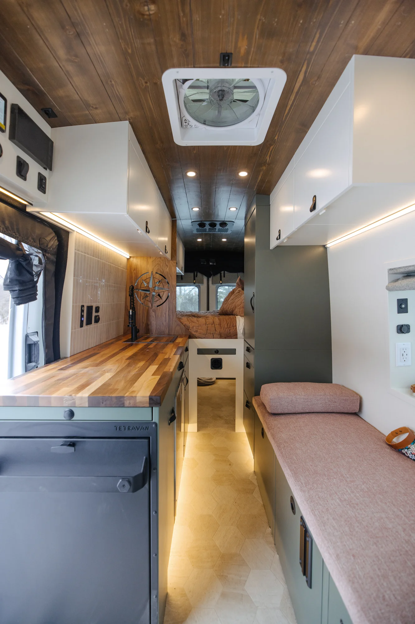 The Drifter 101 custom Ford Transit campervan built for Agnes by Drifter Vans, Drifter layout with sage green cabinetry, a Tetra shower, and Trelino composting toilet