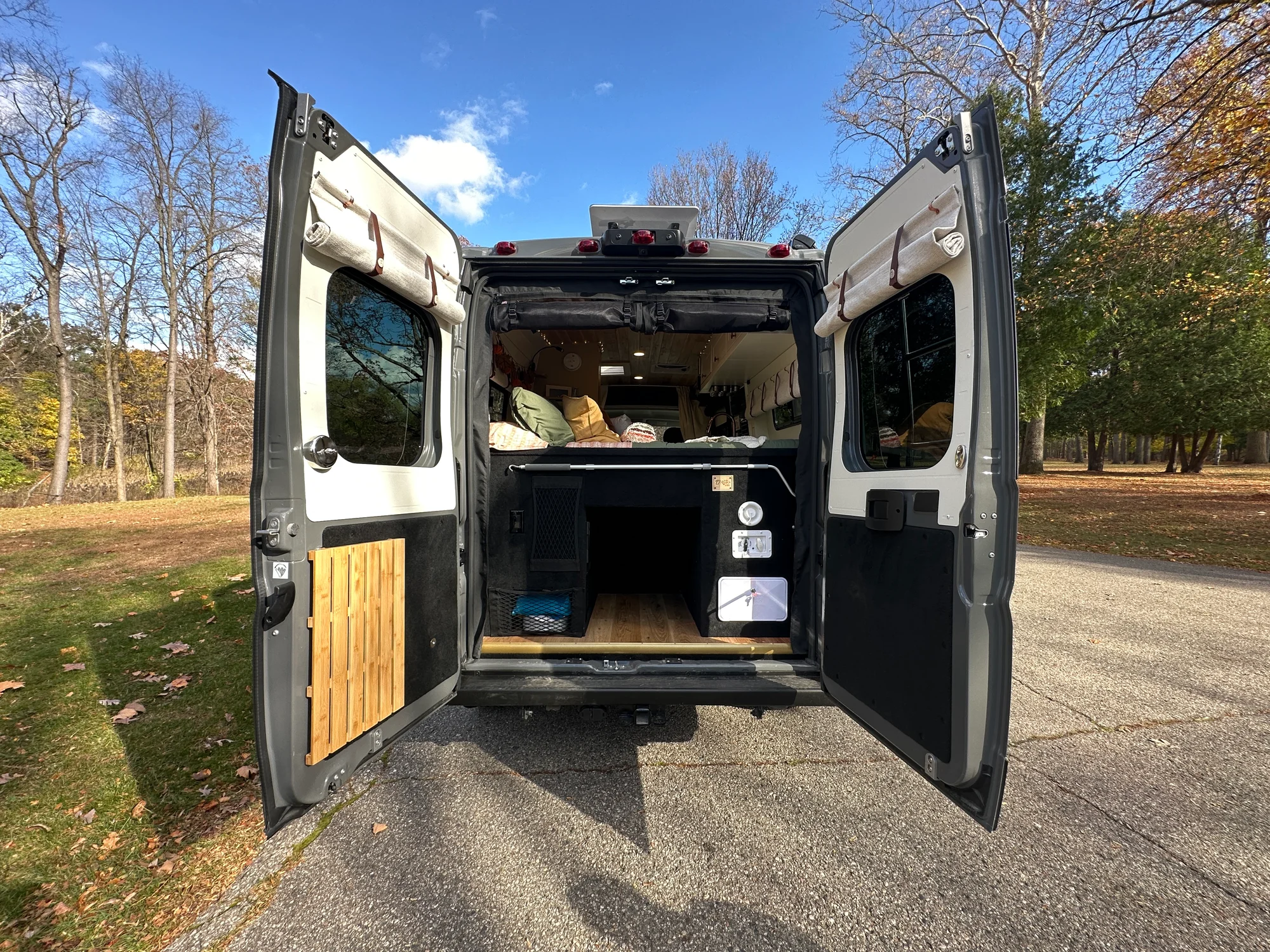 The Drifter 101 custom Ram ProMaster campervan built for Luke and Ashley by Drifter Vans, Drifter layout with a farmhouse interior, butcher block countertop, and wood ceiling