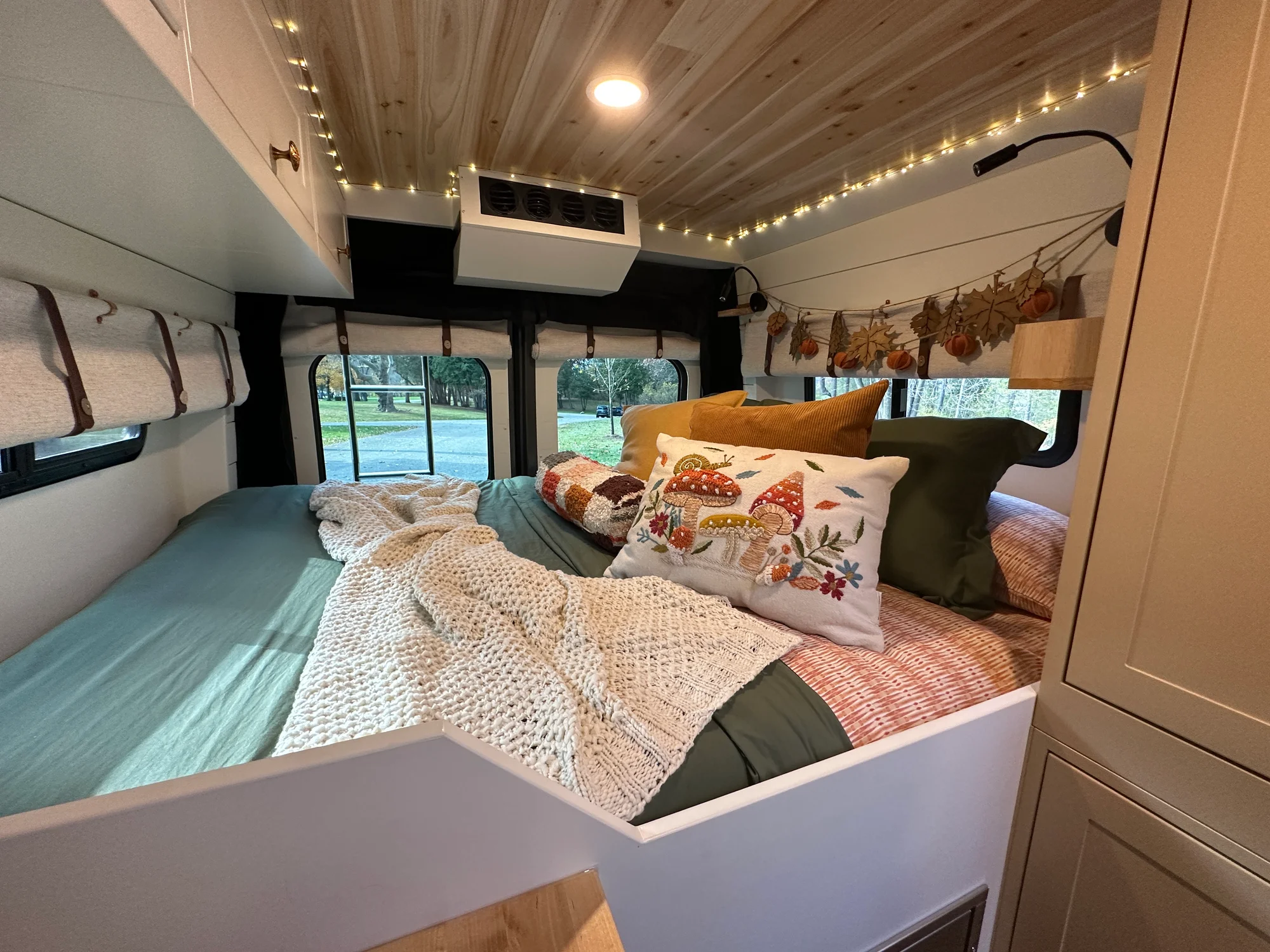 The Drifter 101 custom Ram ProMaster campervan built for Luke and Ashley by Drifter Vans, Drifter layout with a farmhouse interior, butcher block countertop, and wood ceiling