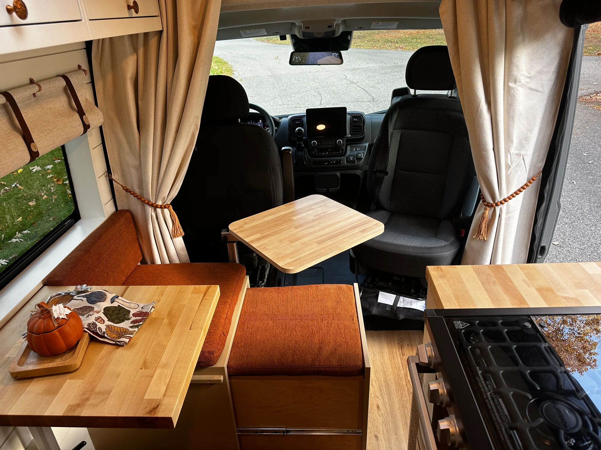 The Drifter 101 custom Ram ProMaster campervan built for Luke and Ashley by Drifter Vans, Drifter layout with a farmhouse interior, butcher block countertop, and wood ceiling