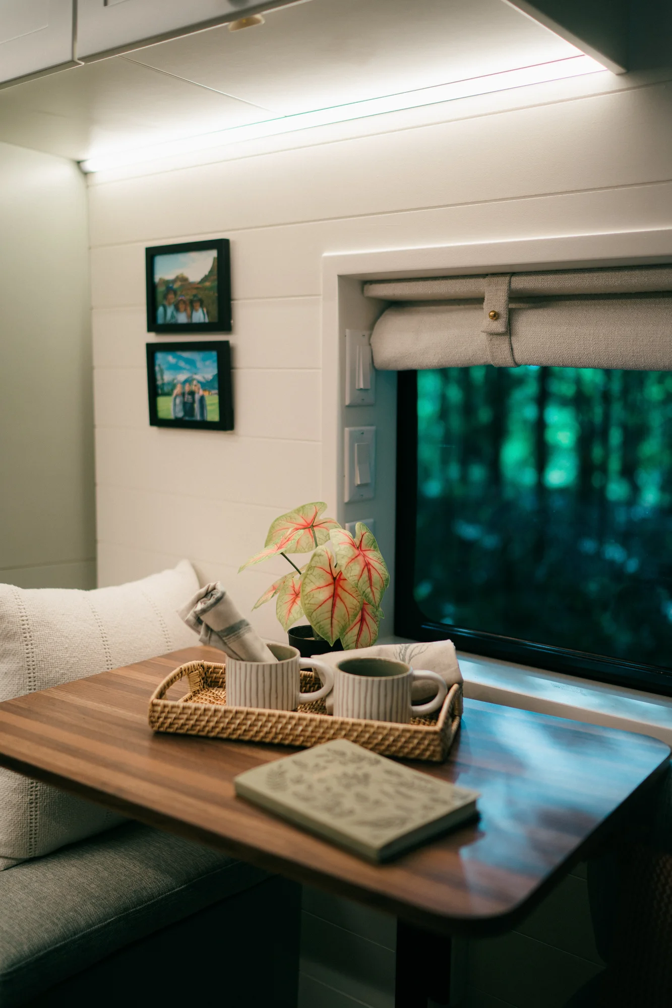 The Drifter 101 custom Ford Transit campervan built for Heather by Drifter Vans, Drifter layout with a full oven, patterned tile backsplash, brass faucet, and natural wood cabinetry