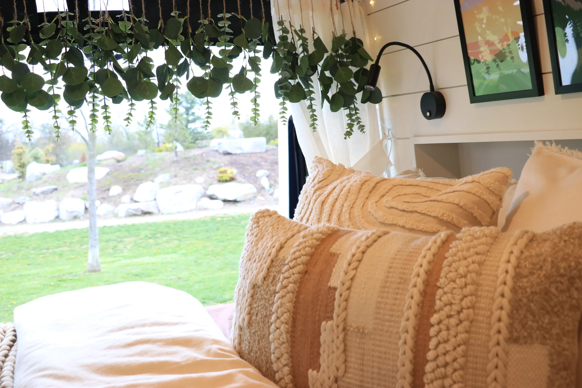 The Drifter 101 custom Ford Transit campervan built for Sarah by Drifter Vans, Nomadik layout with a marble-style wet bath, gold faucet, trifold privacy door, and boho accents