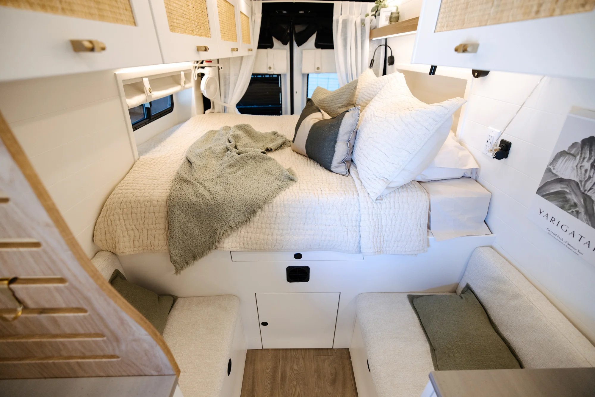 The Drifter 101 custom Ford Transit campervan built for Alison by Drifter Vans, Nomadik layout with a Japandi interior, white cabinetry, gold rain shower, and marble wet bath
