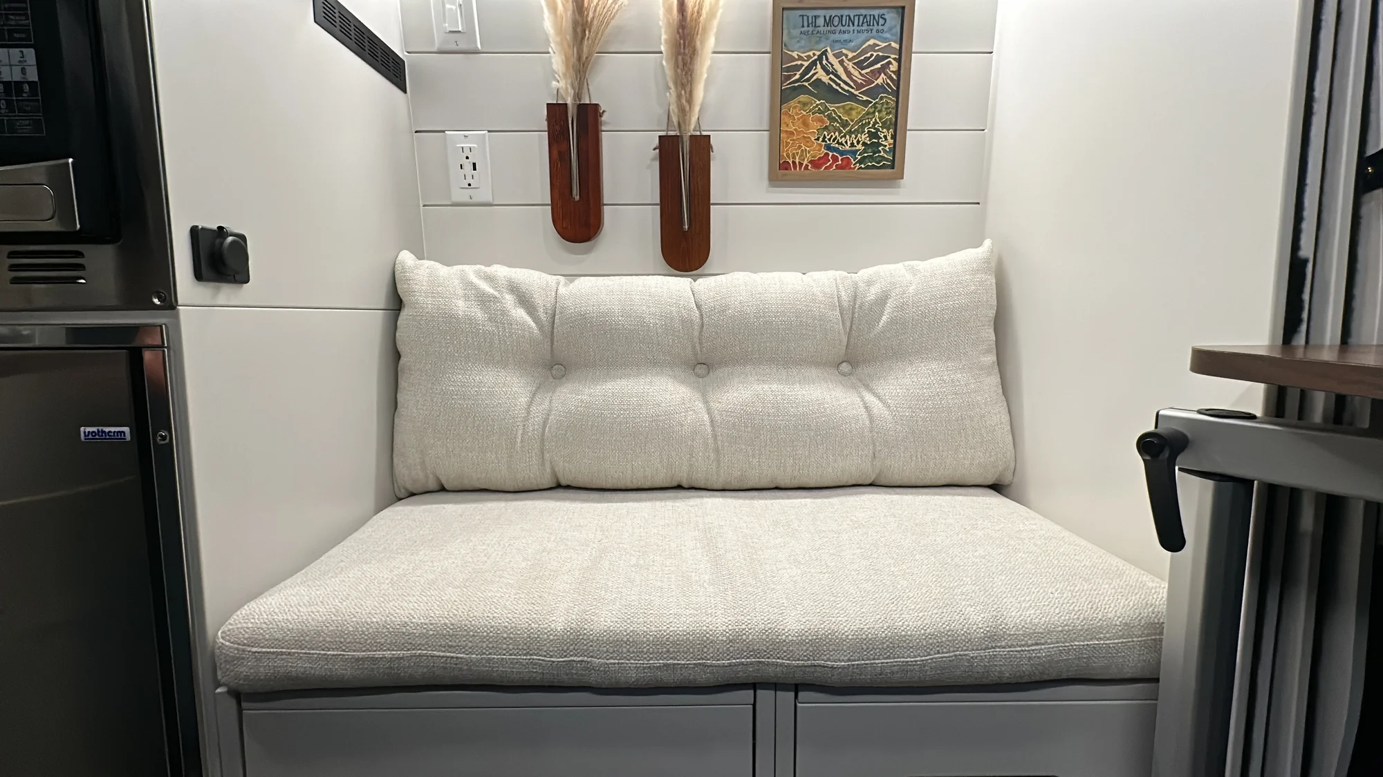 The Drifter 101 custom Ford Transit campervan built for Lynne by Drifter Vans, Drifter layout with a mid-century modern interior, dark walnut countertop, and gold hardware
