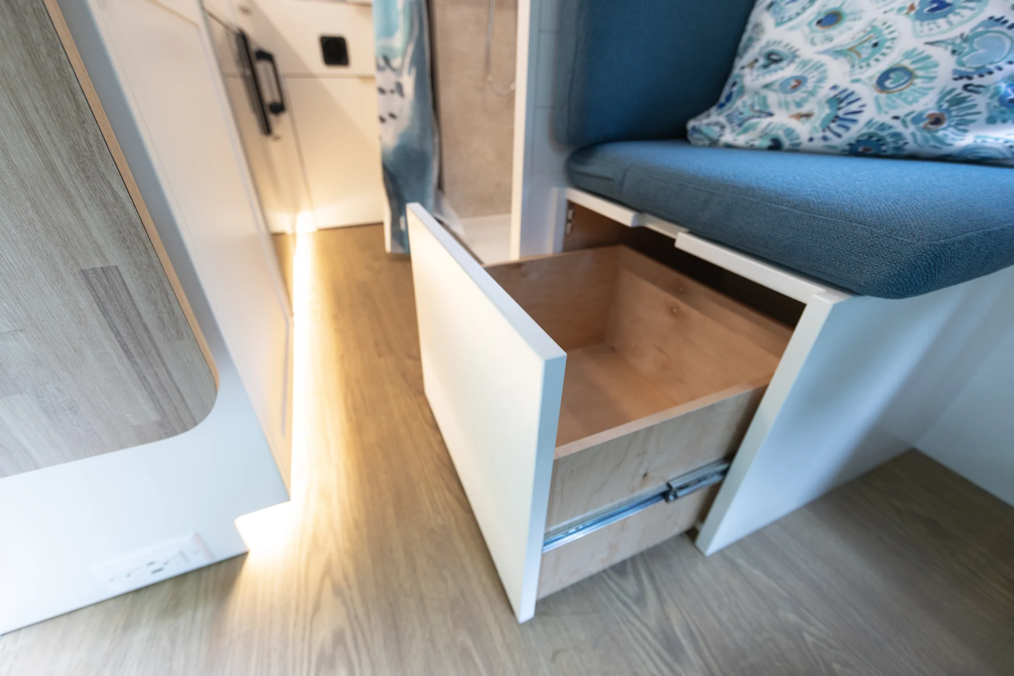 The Drifter 101 custom Ford Transit campervan built for Peter and Linka by Drifter Vans, Scout layout with a coastal interior, light finishes, EcoFlow off-grid power, and a remote work setup