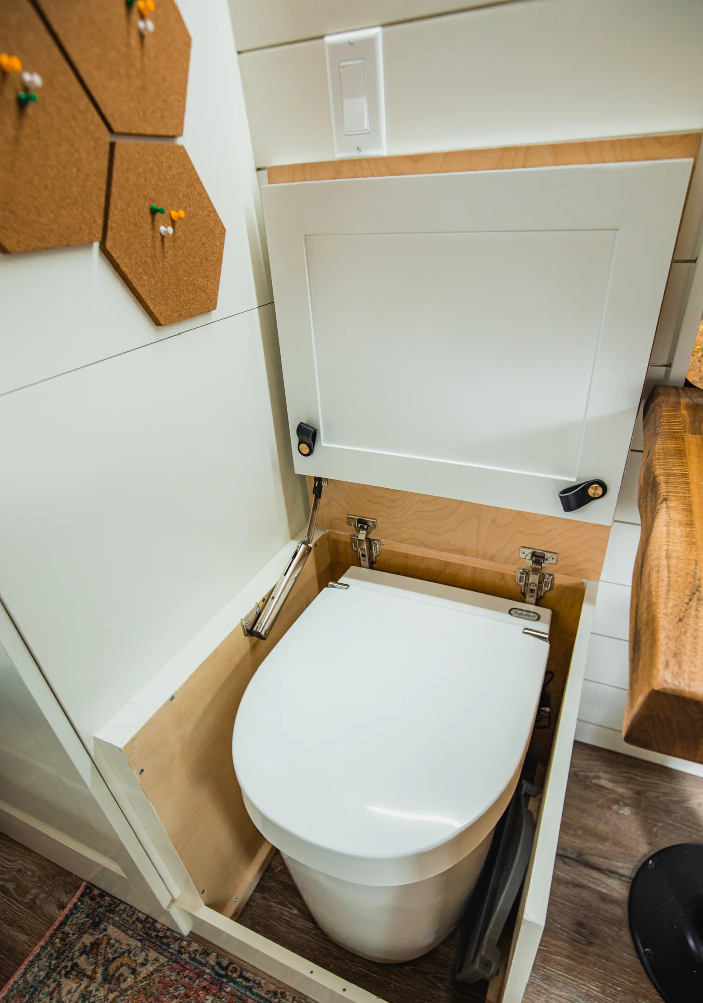 The Drifter 101 custom Ford Transit campervan built for Tess by Drifter Vans, Wanderer layout with a Nordic interior, white shiplap walls, wood ceiling, and gray seating