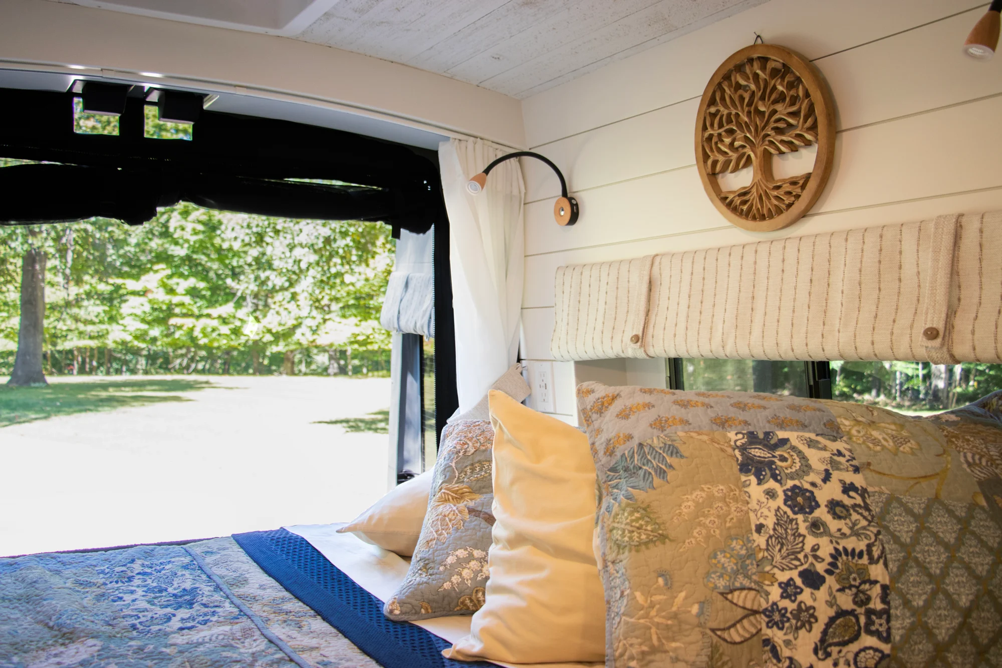 The Drifter 101 custom Ford Transit campervan built for Steph and Jen by Drifter Vans, Wanderer layout with a brick backsplash, sage green cabinetry, and farmhouse lighting